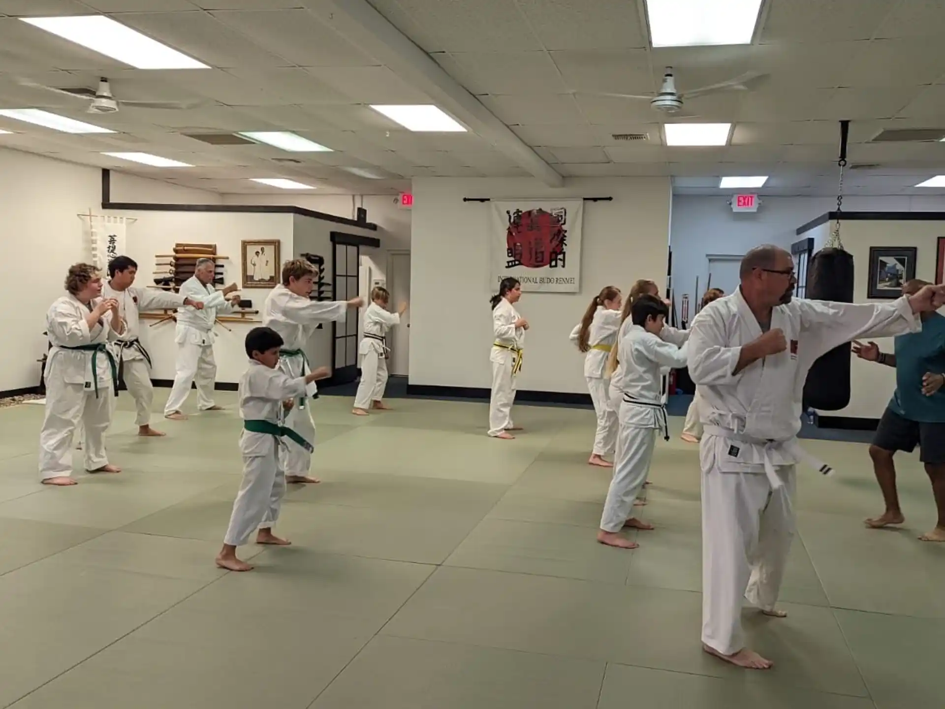 a group of people in karate uniforms