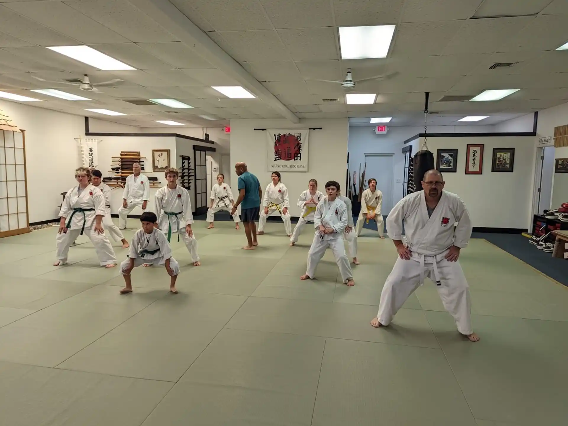 a group of people in karate uniforms