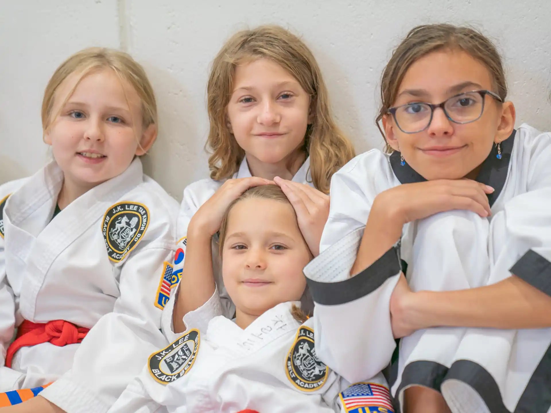 a group of girls in white uniforms