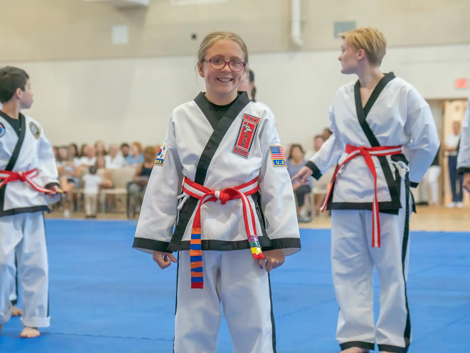 a group of people in karate uniforms