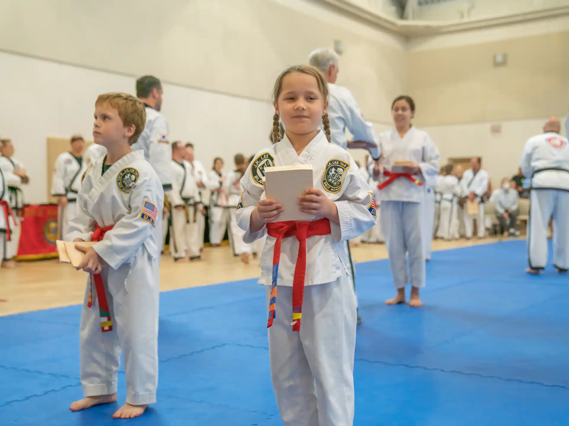 a group of people in karate uniforms