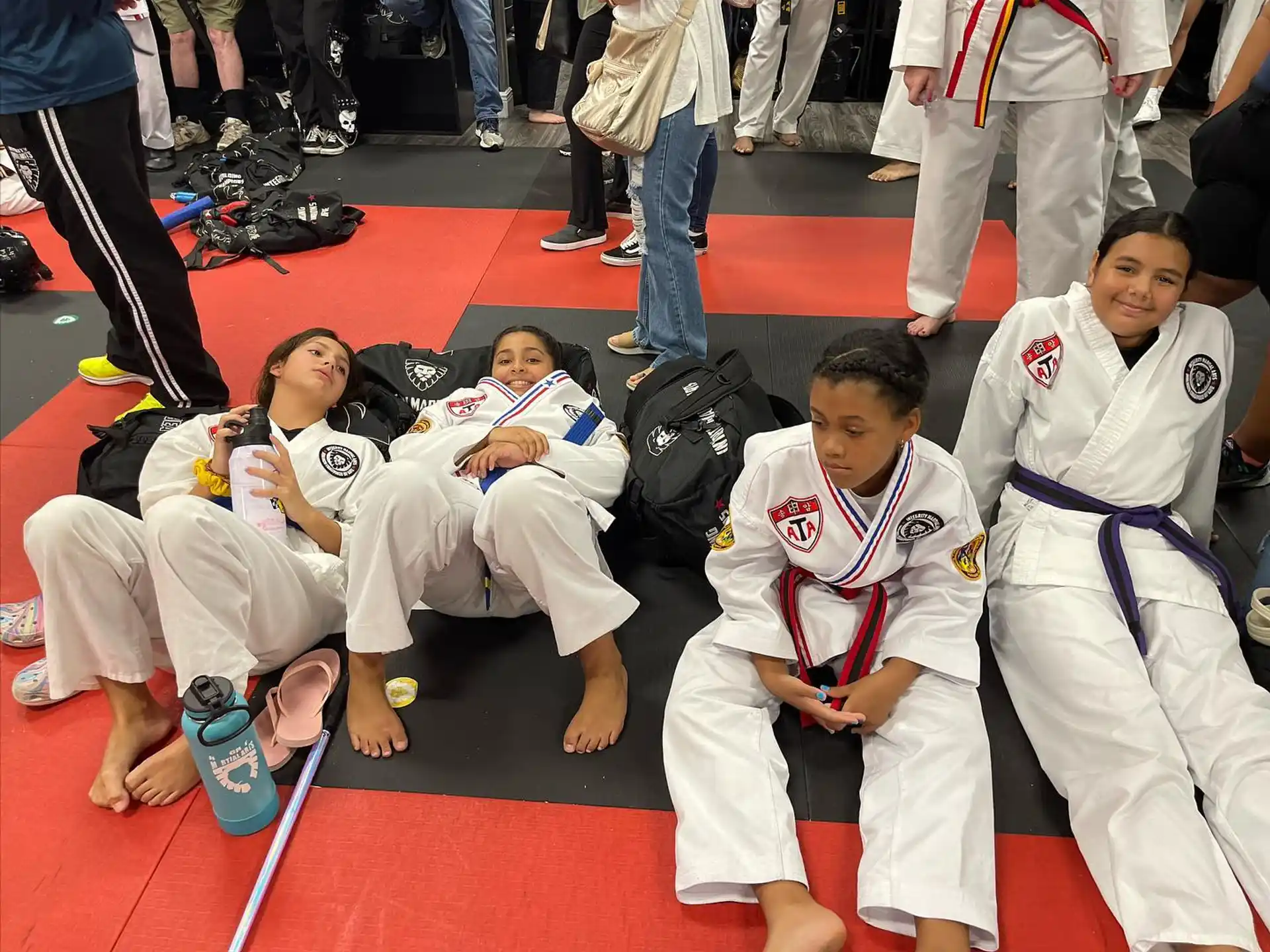 a group of people in karate uniforms