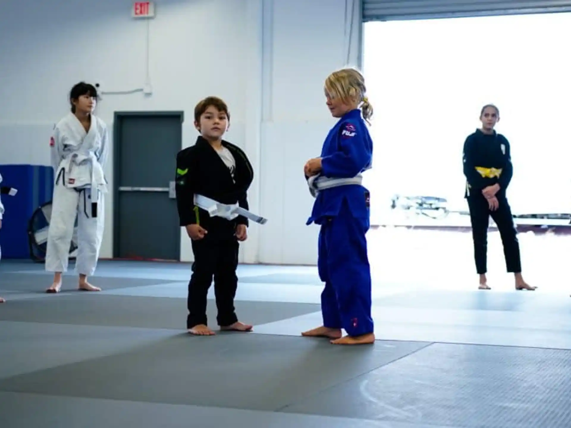 a group of people in karate uniforms