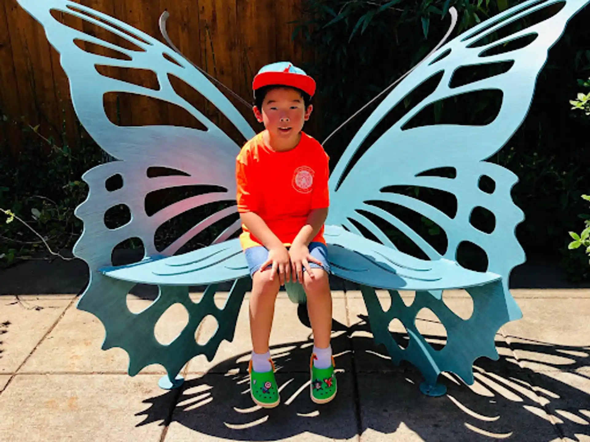 a boy sitting on a bench