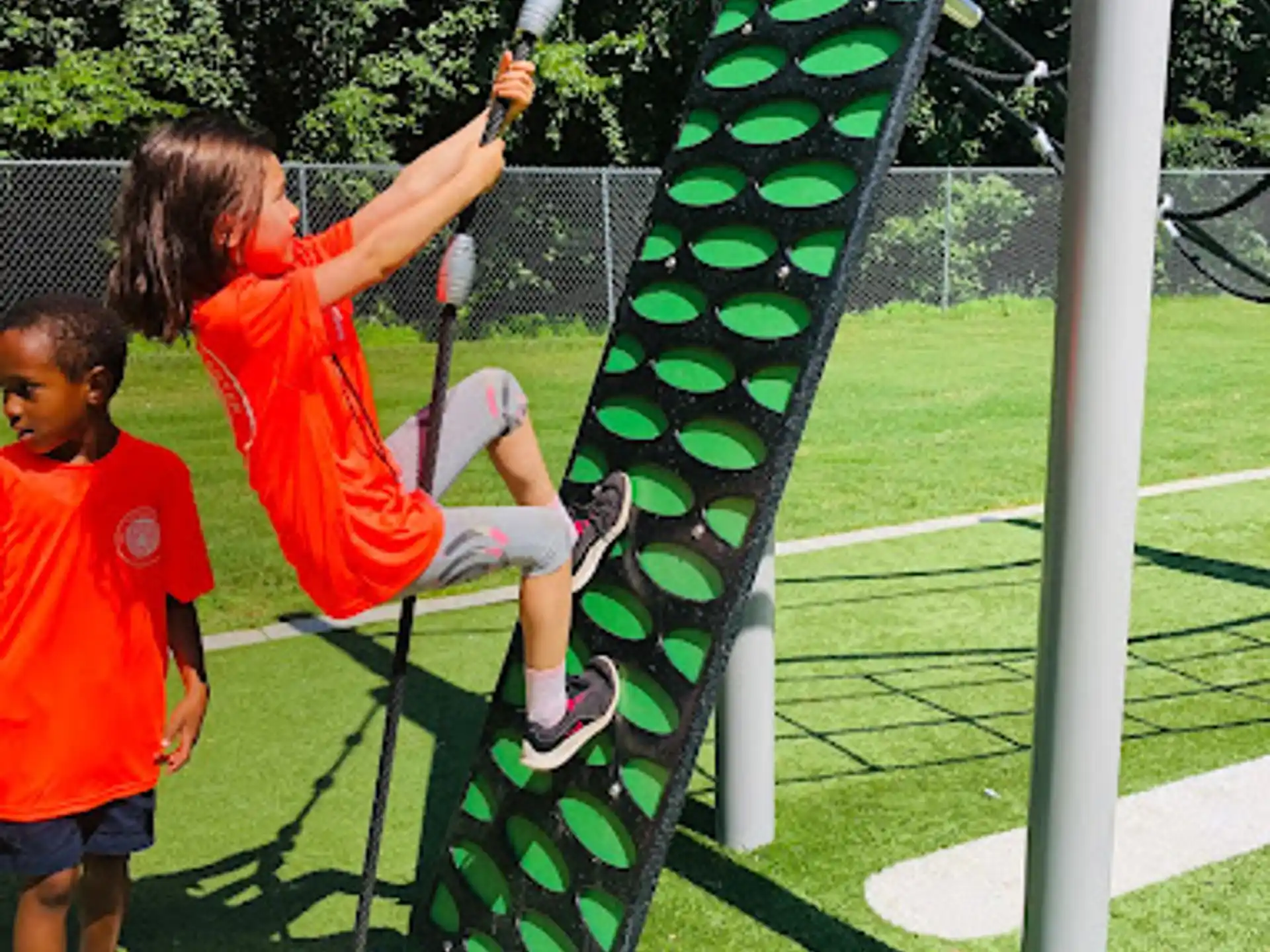 kids playing on a swing set