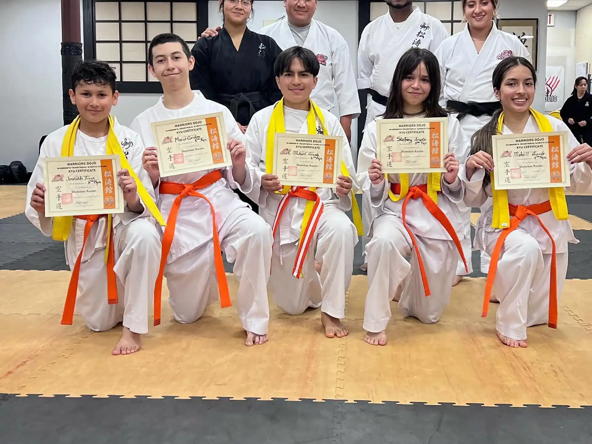 a group of people wearing karate uniforms