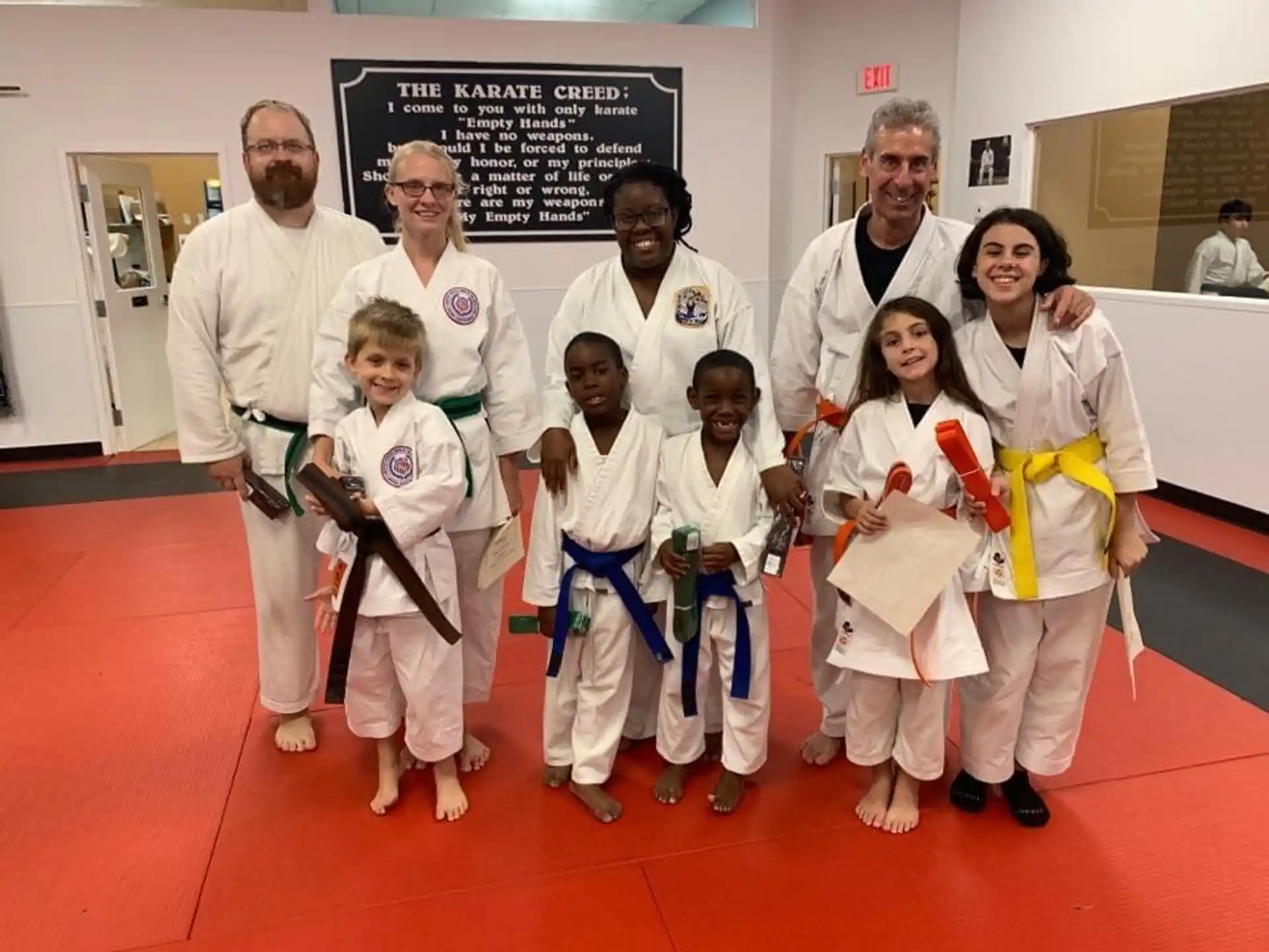 a group of people in karate uniforms