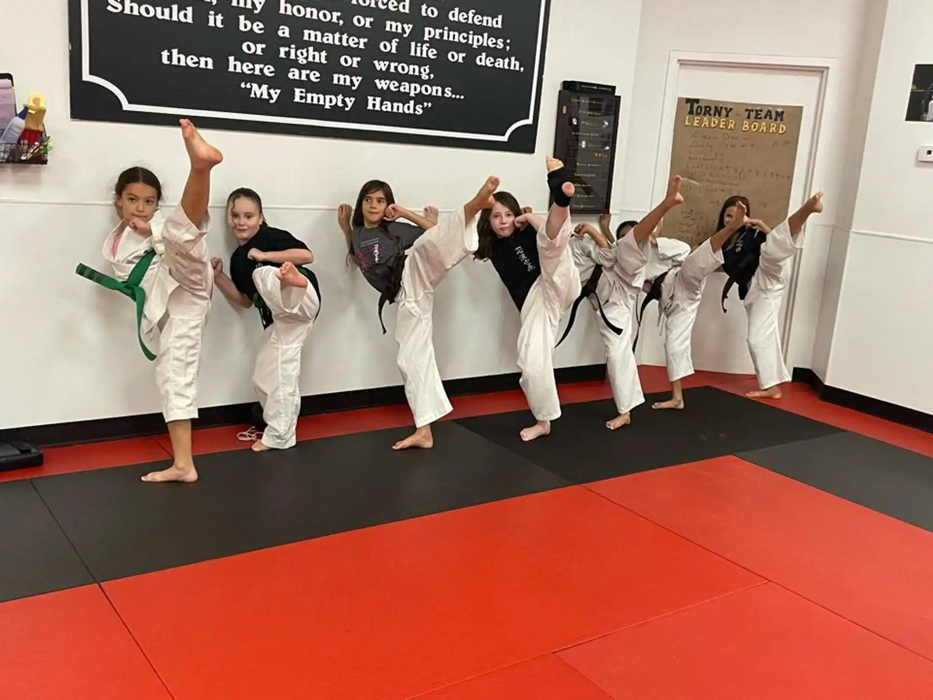 a group of people in karate uniforms