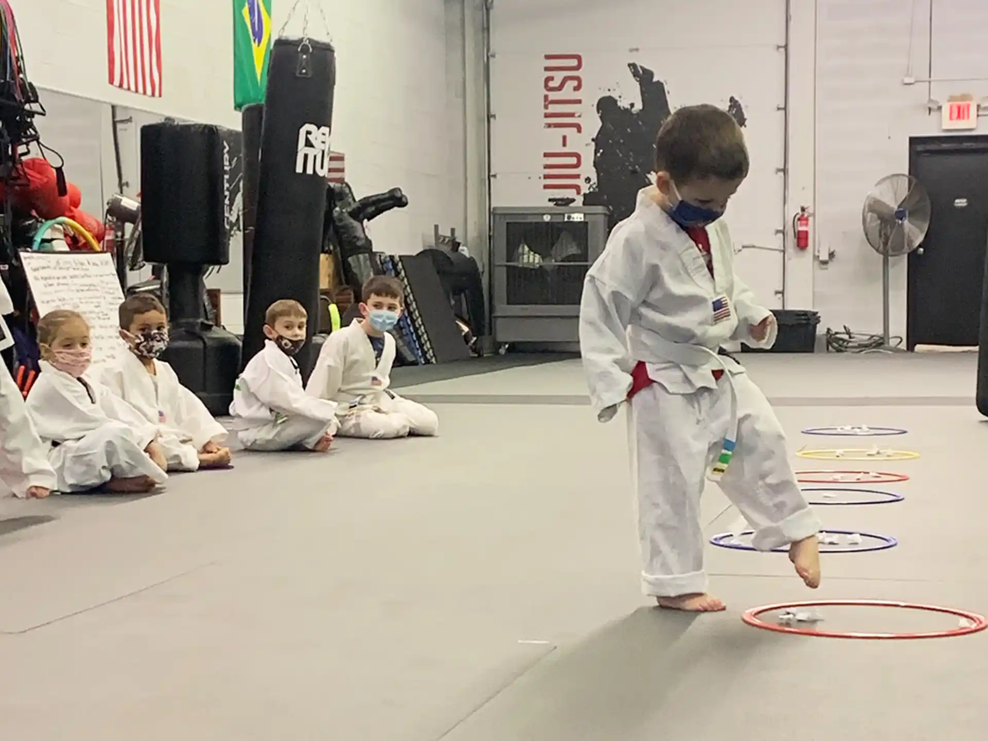 a group of kids in karate uniforms