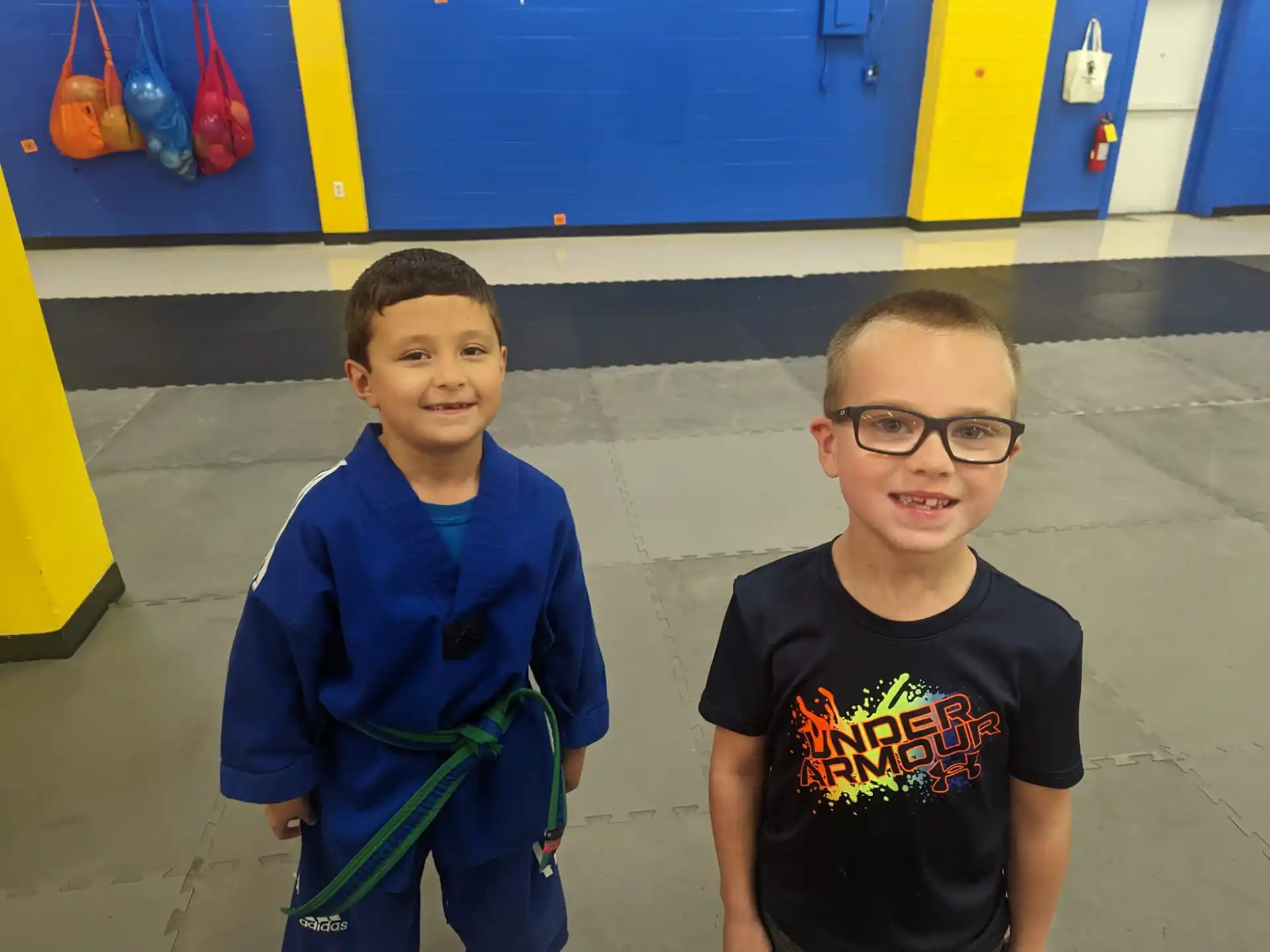 two boys standing next to each other