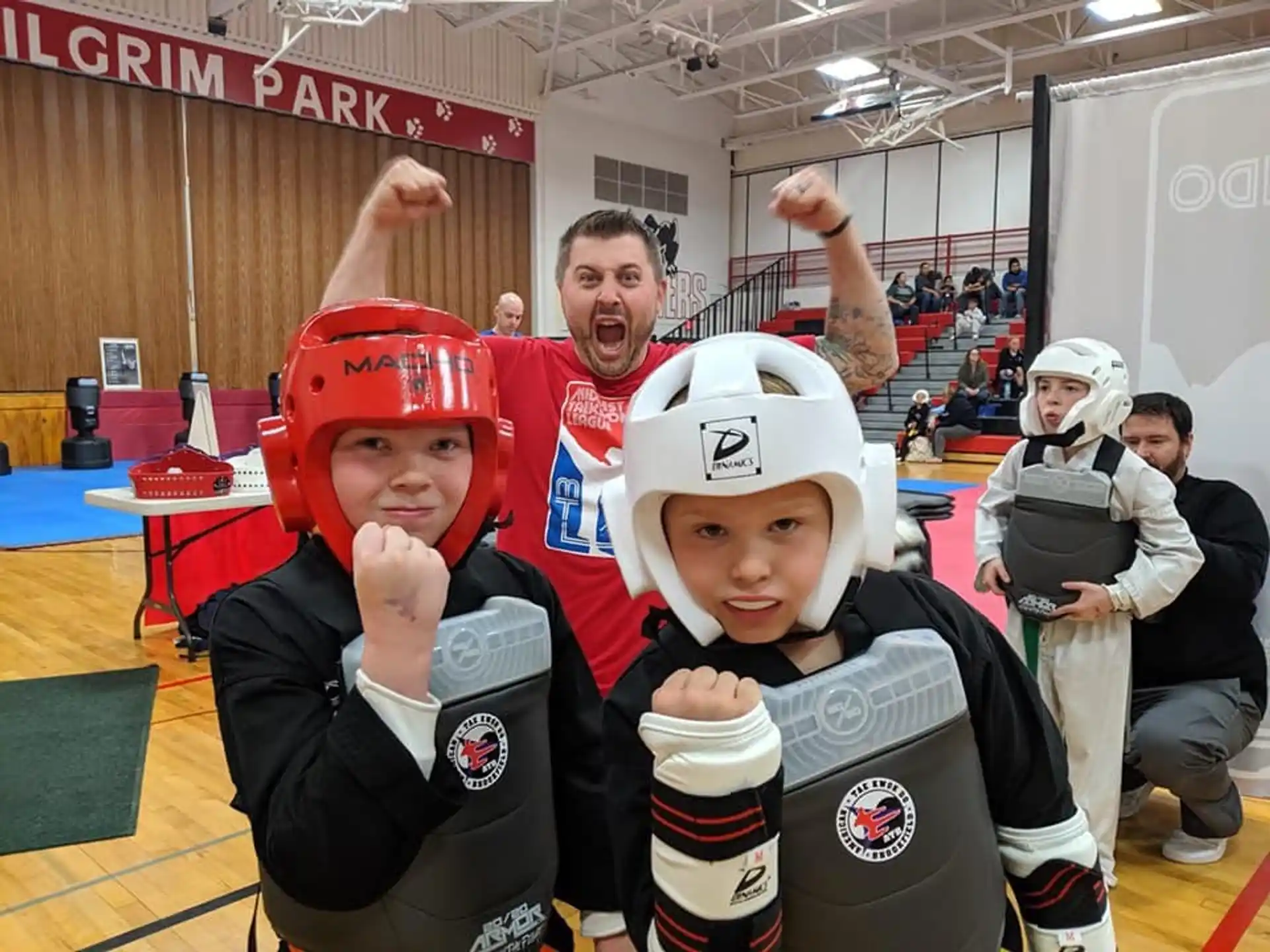 a person and a boy wearing hockey gear