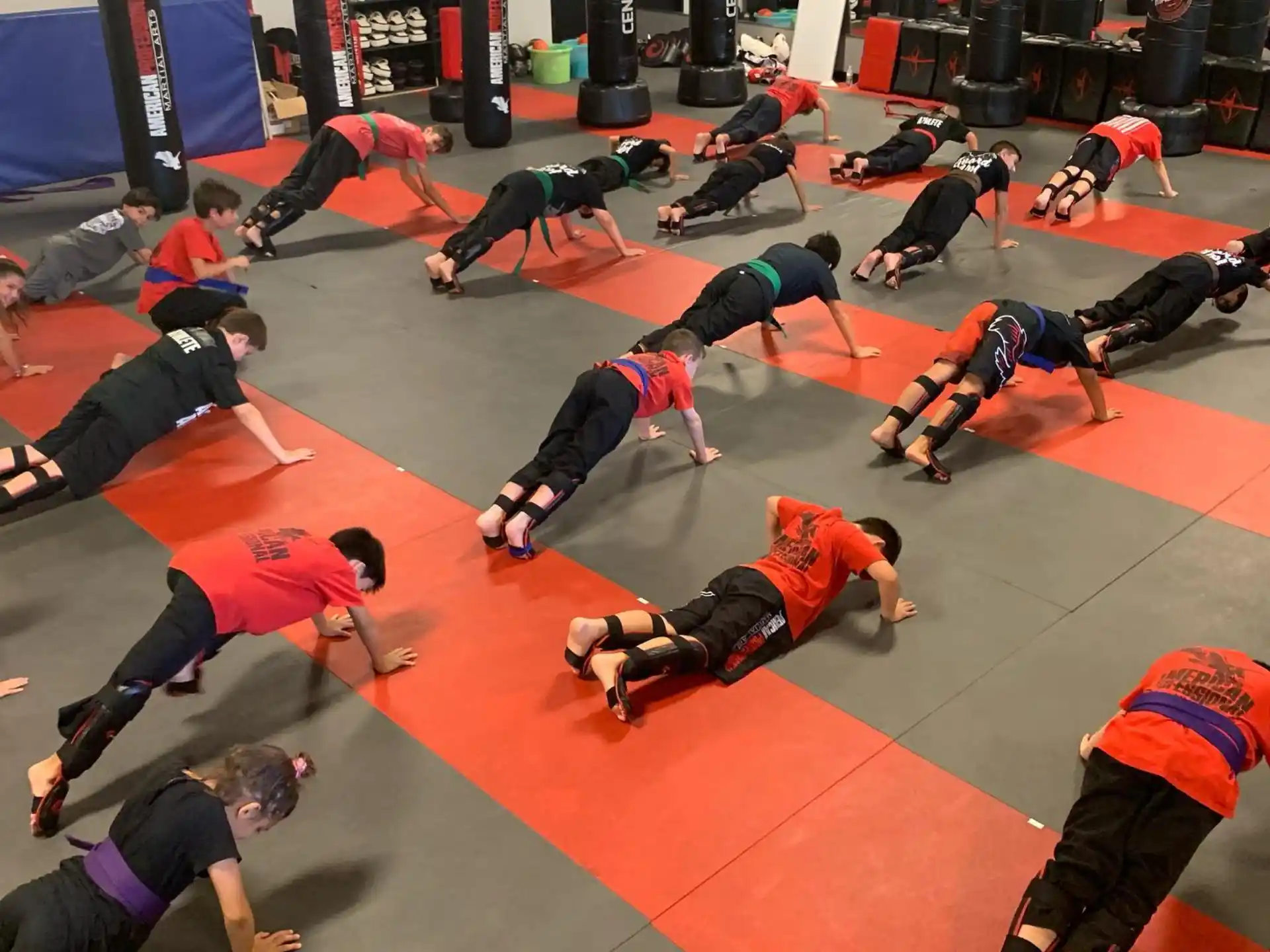 a group of people in a wrestling ring