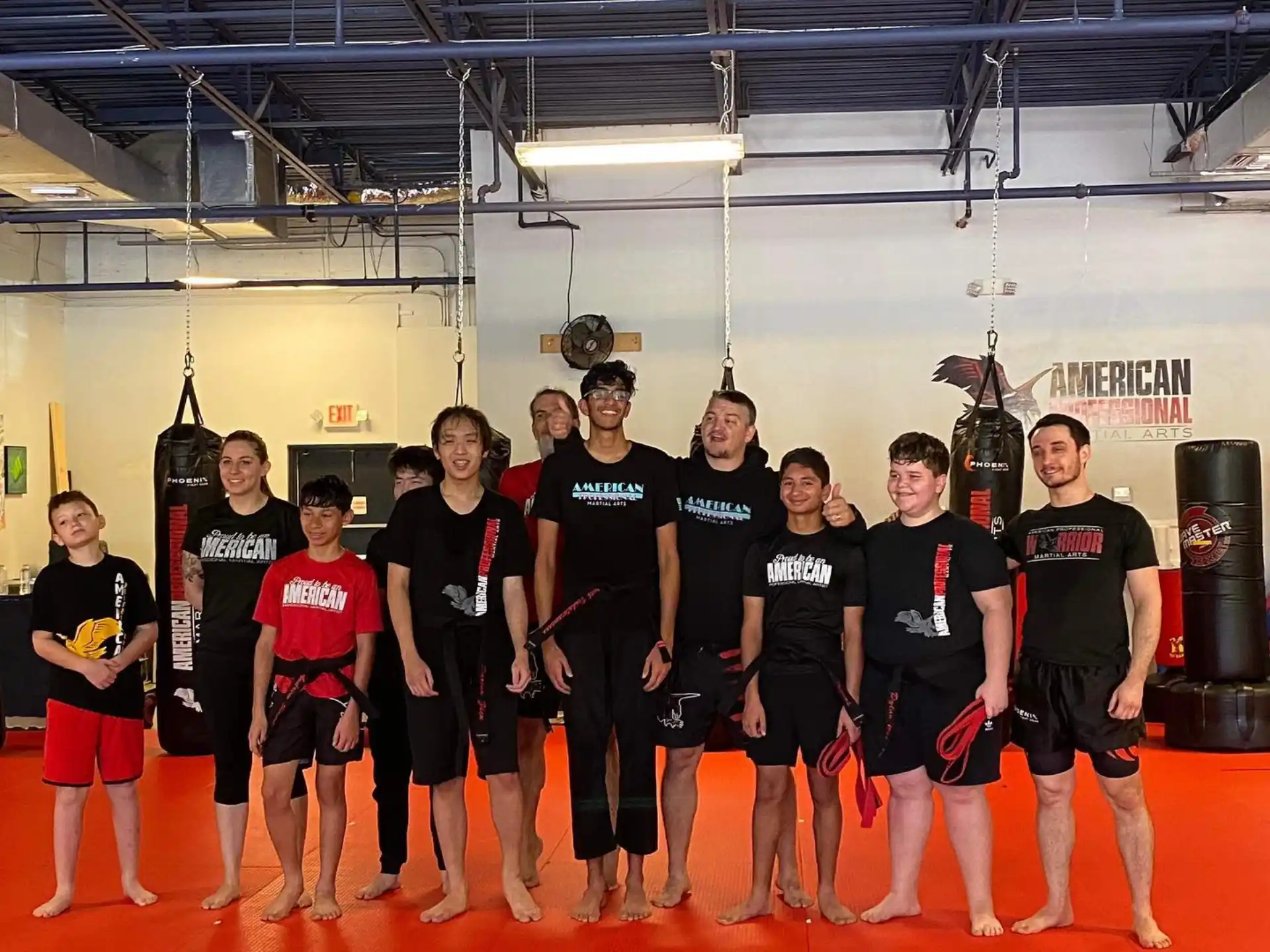 a group of people wearing black shirts