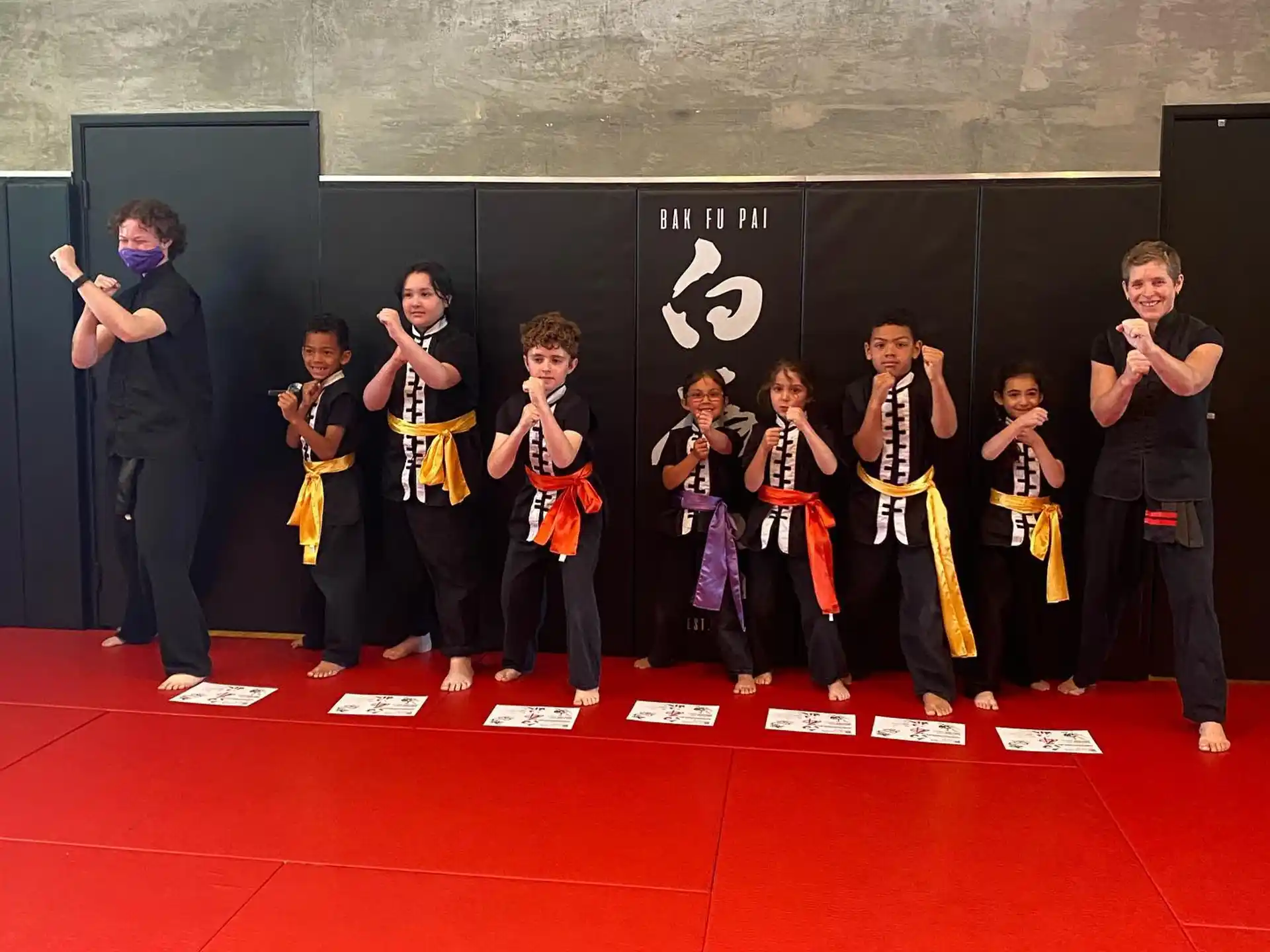 a group of people in karate uniforms