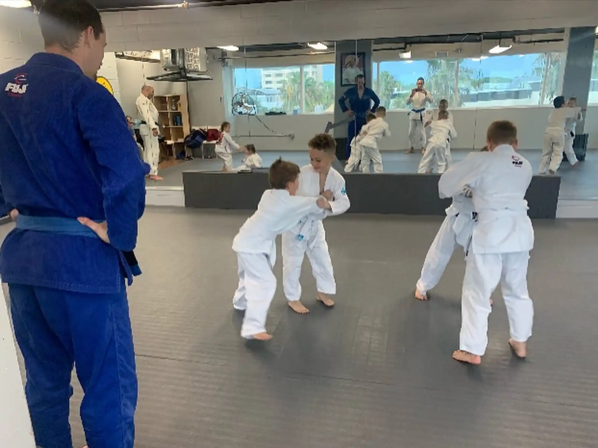 a group of people in karate uniforms