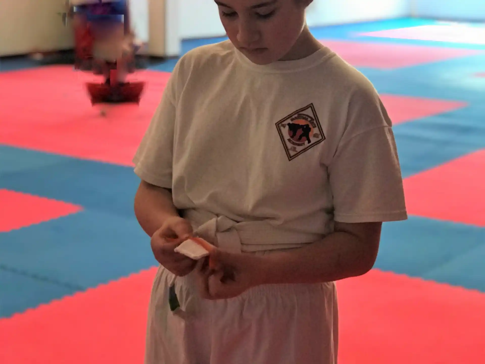 a child standing on a red carpet