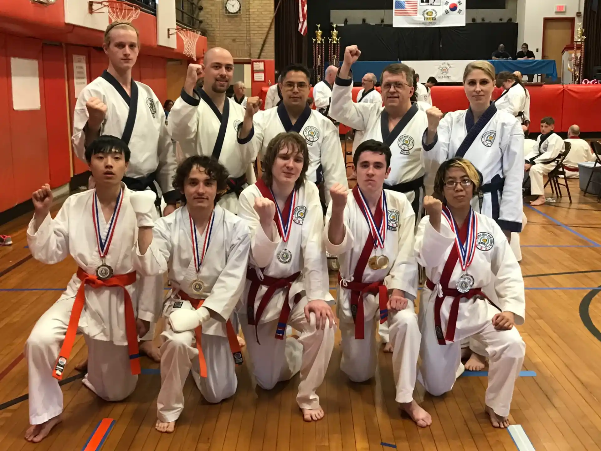 a group of people wearing white robes and posing for a photo