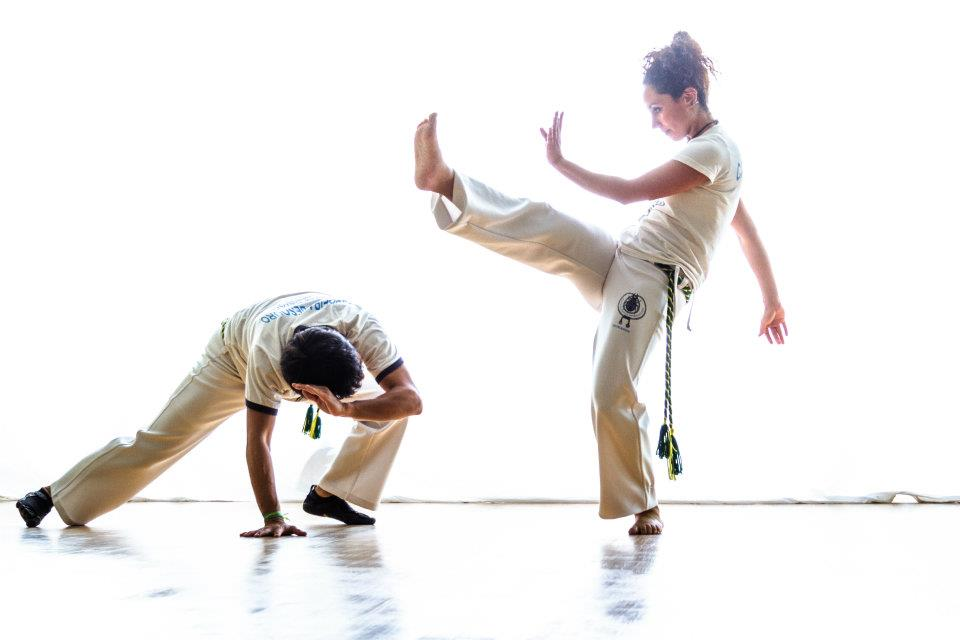 a man kicking another man