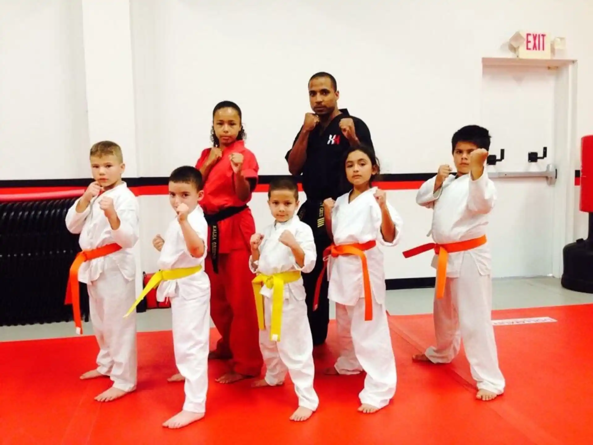 a group of people in karate uniforms