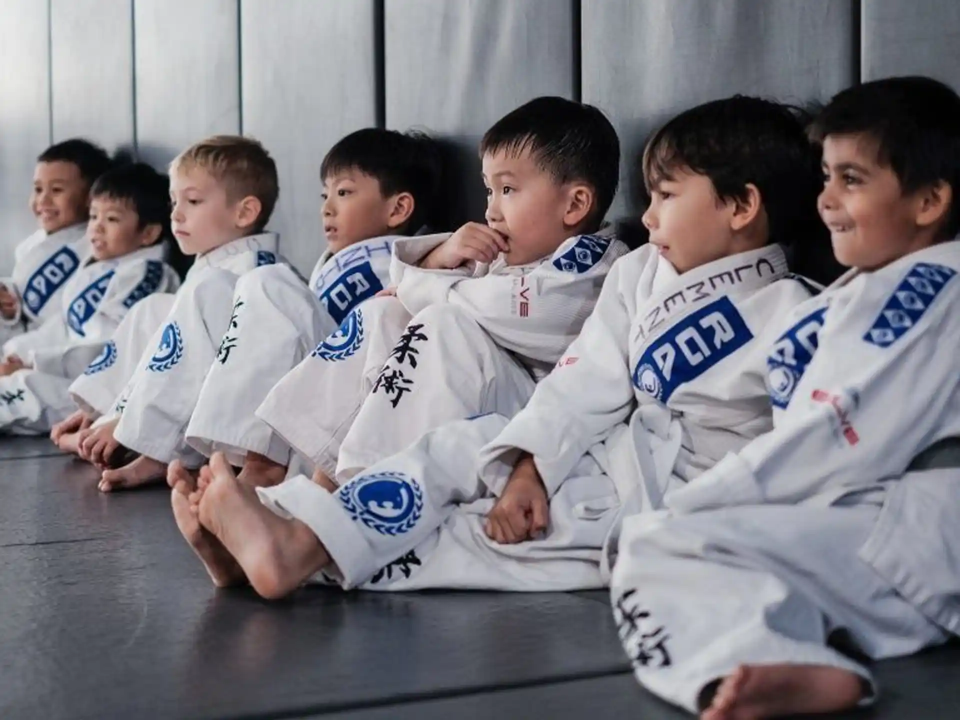 a group of boys in karate uniforms