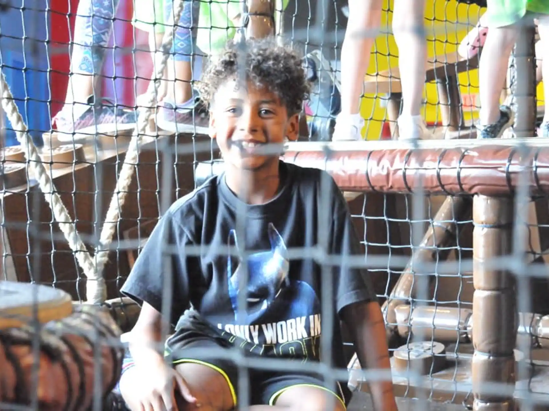 a boy in a cage