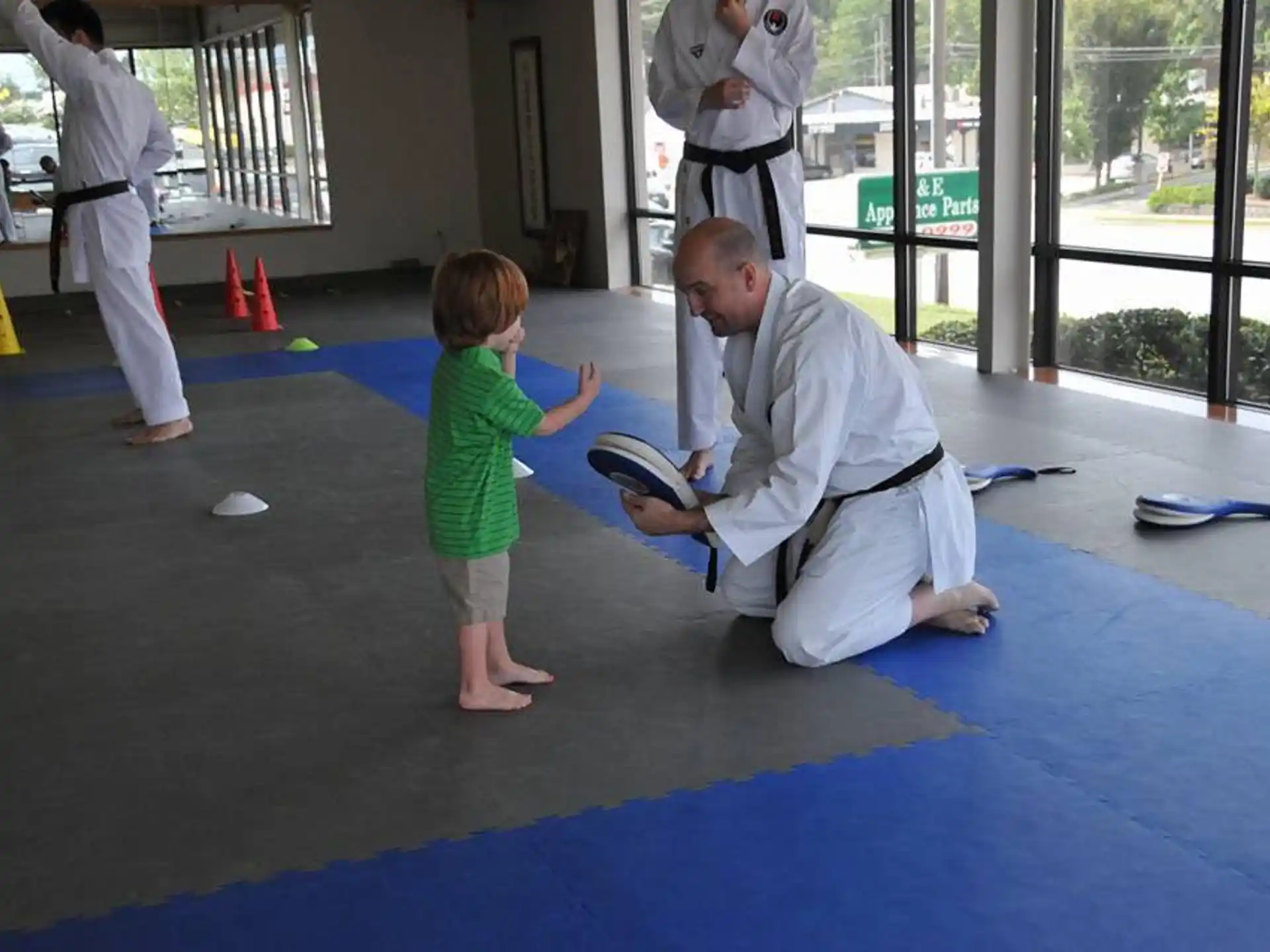 a person reading a book to a child