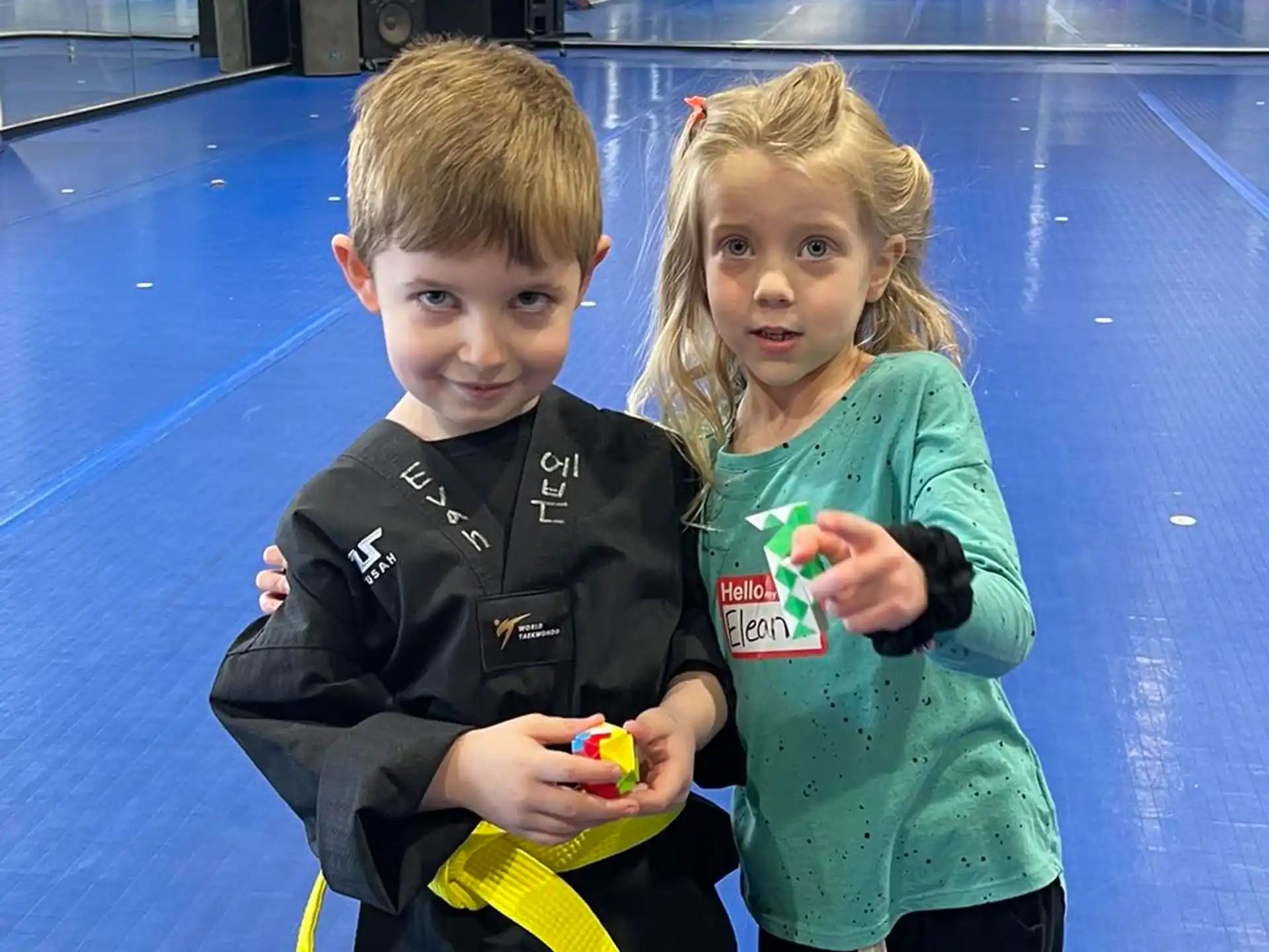 a boy and girl holding toys
