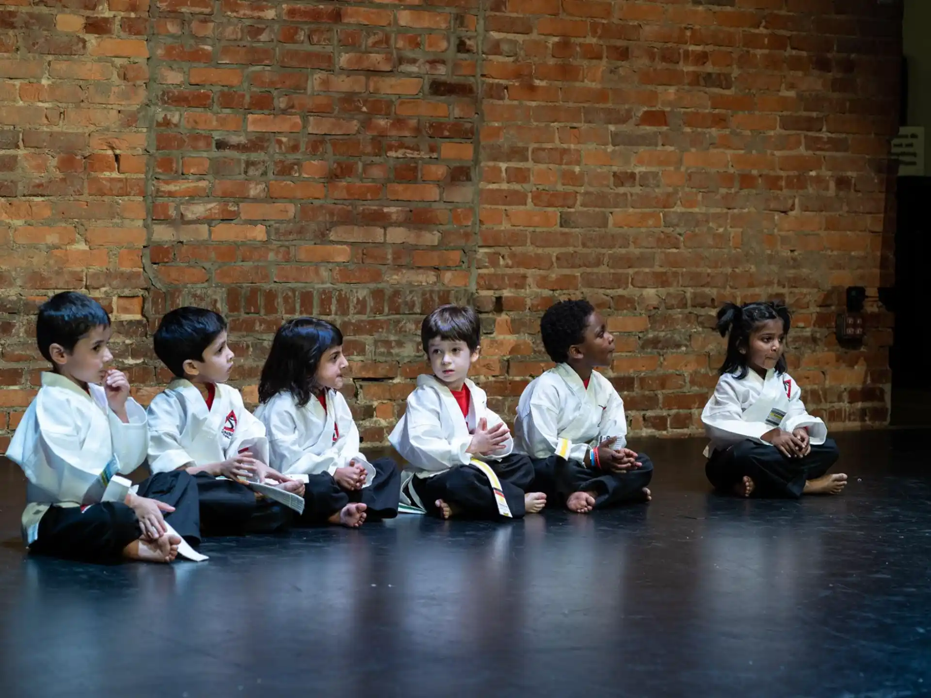 a group of children sitting on the floor