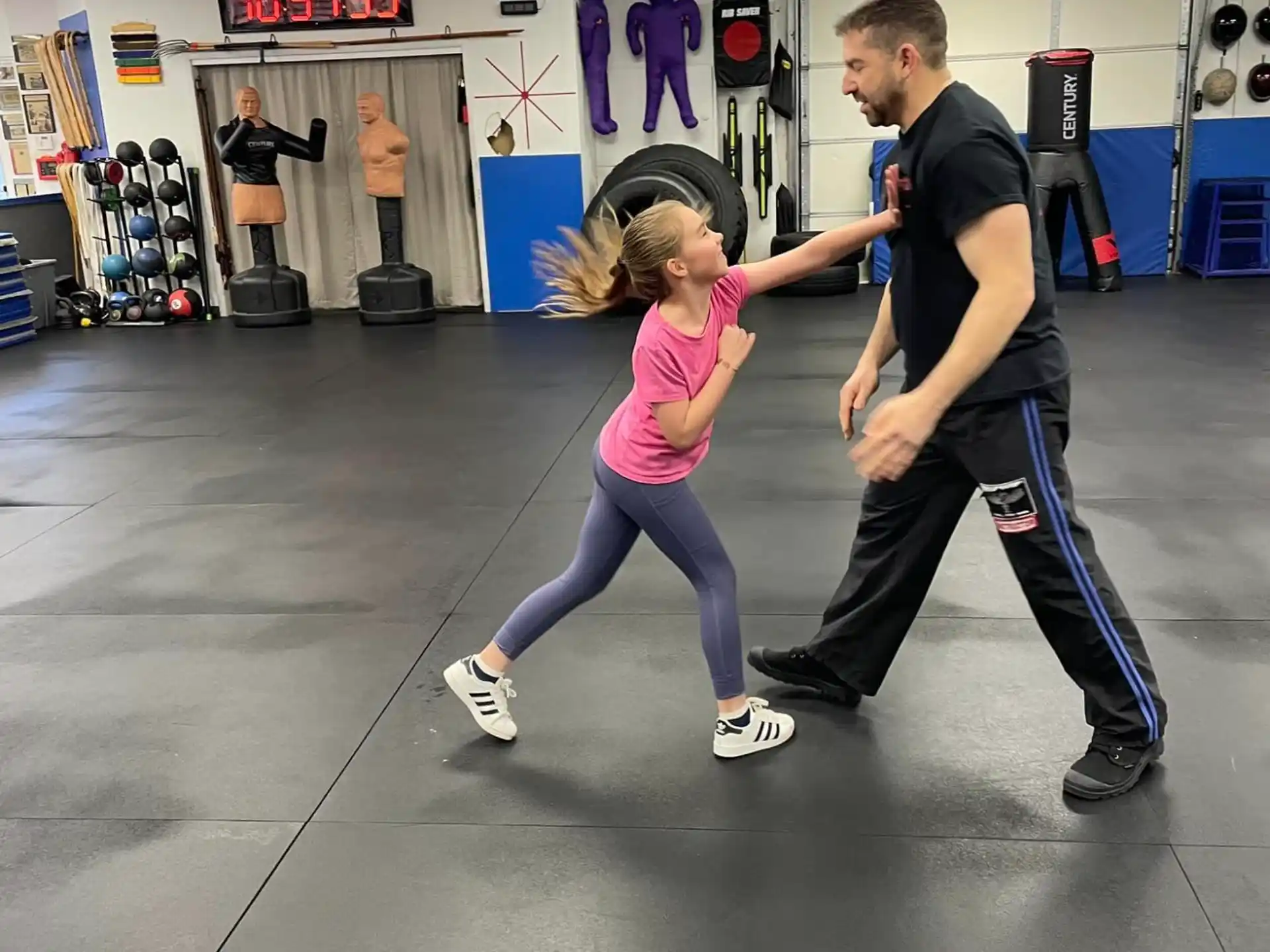 a person and a girl dancing