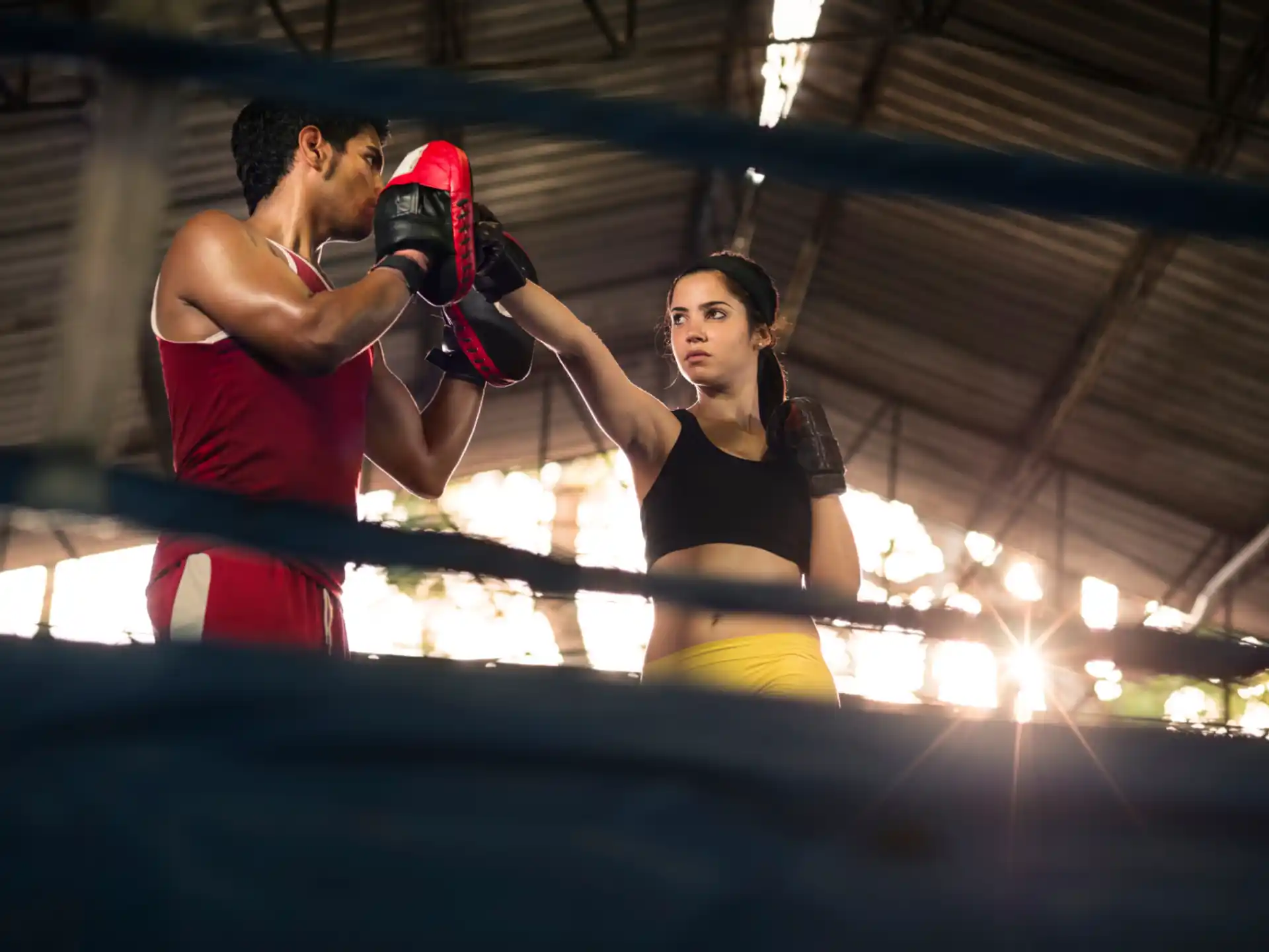 a man and woman boxing