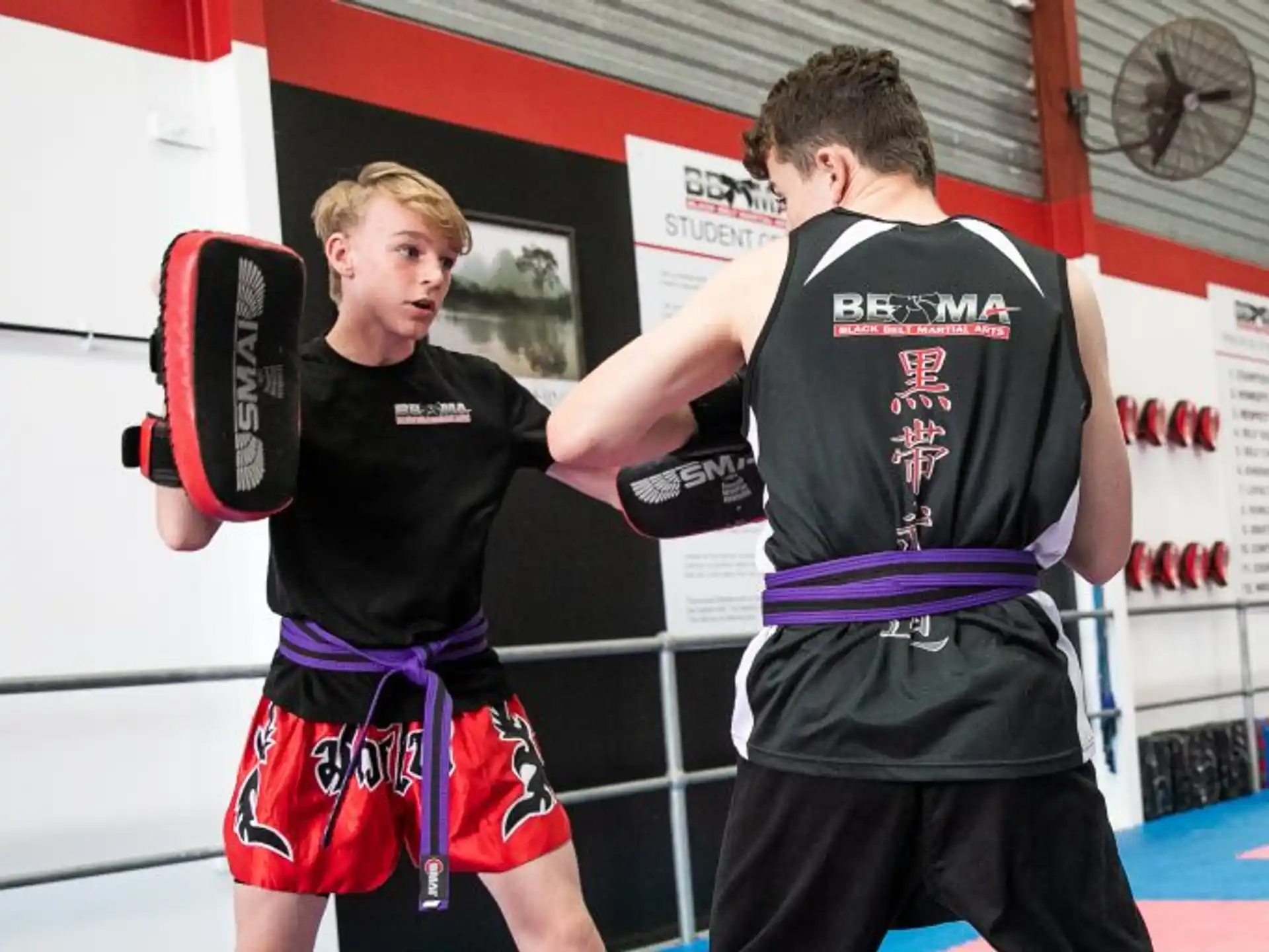 two men wearing boxing gloves