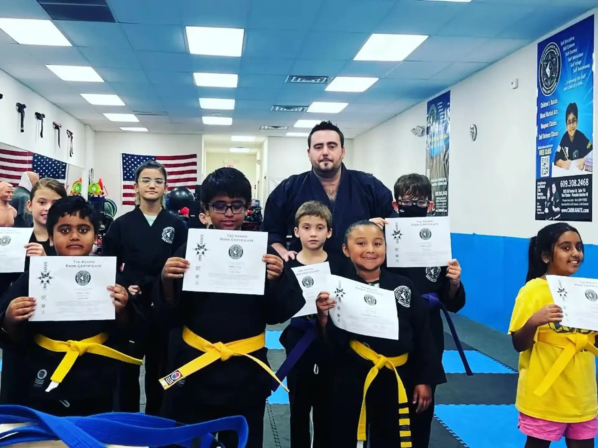 a group of people holding certificates