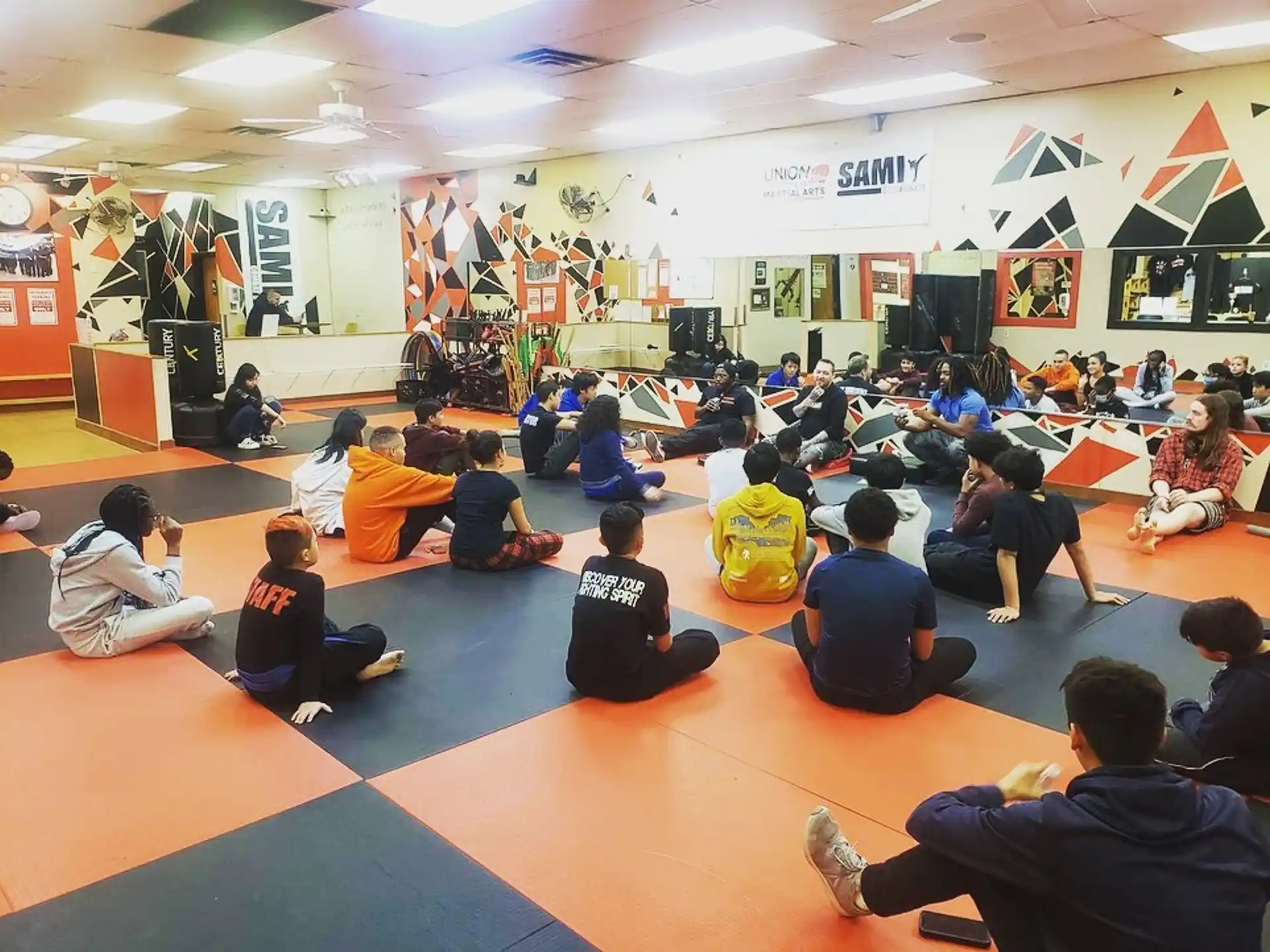 a group of people sitting on the floor