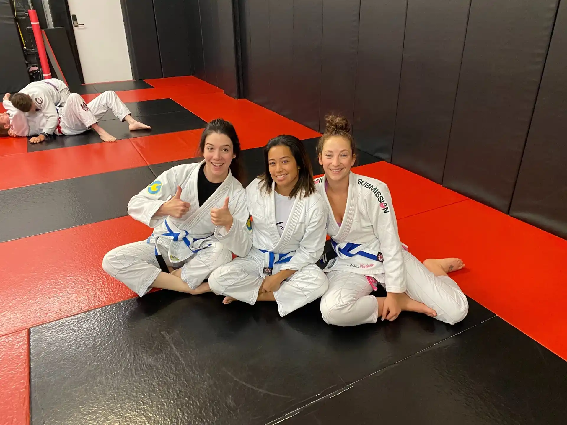 a group of people in karate uniforms