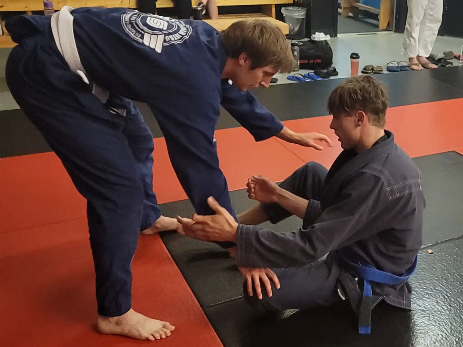 a man doing a push up on a man's back