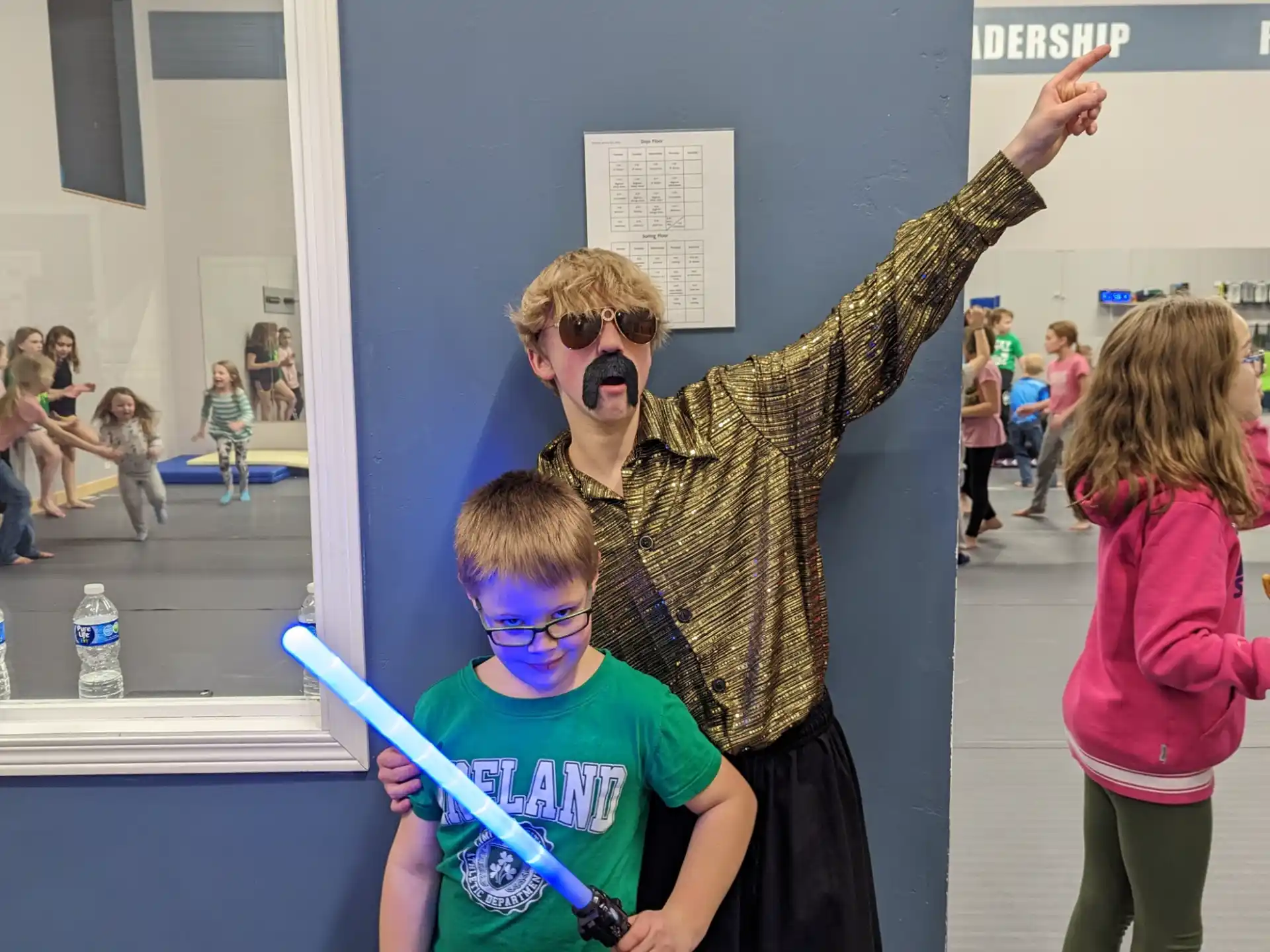 a person in a garment with a boy in a garment