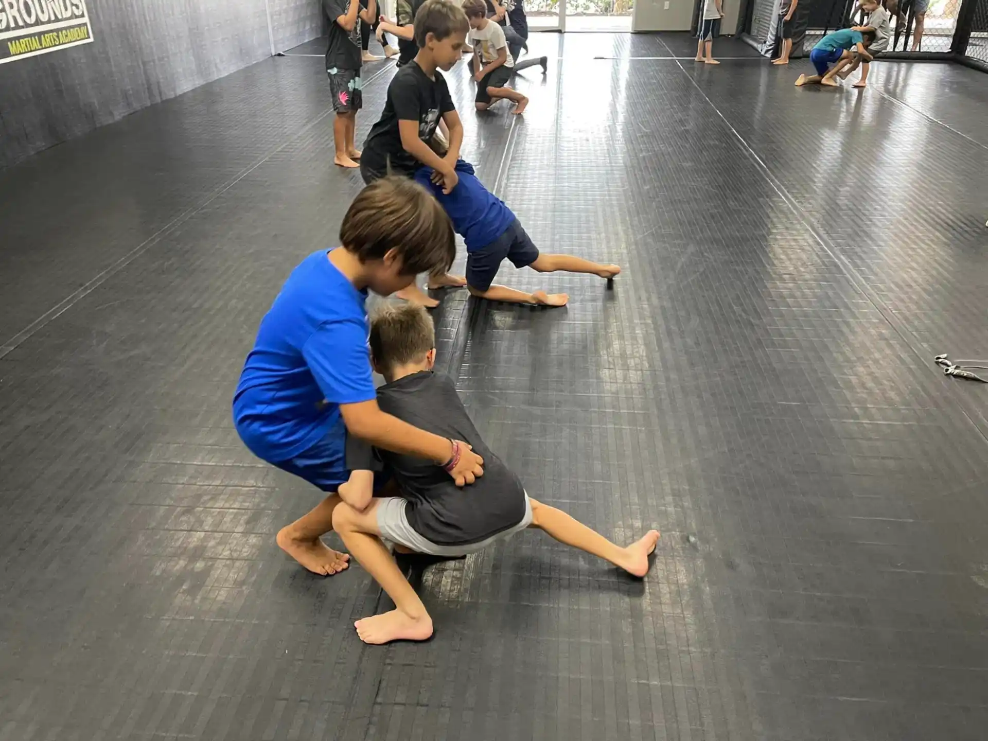 a group of boys playing on the floor