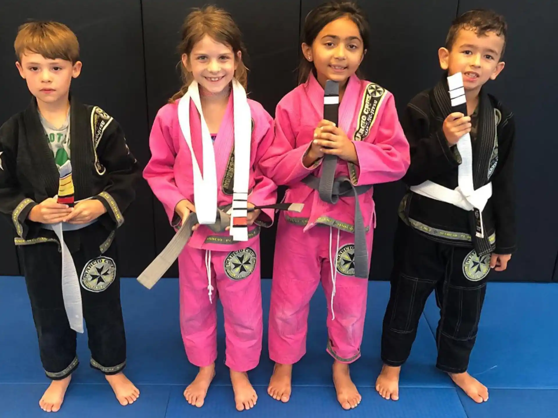 a group of kids holding microphones