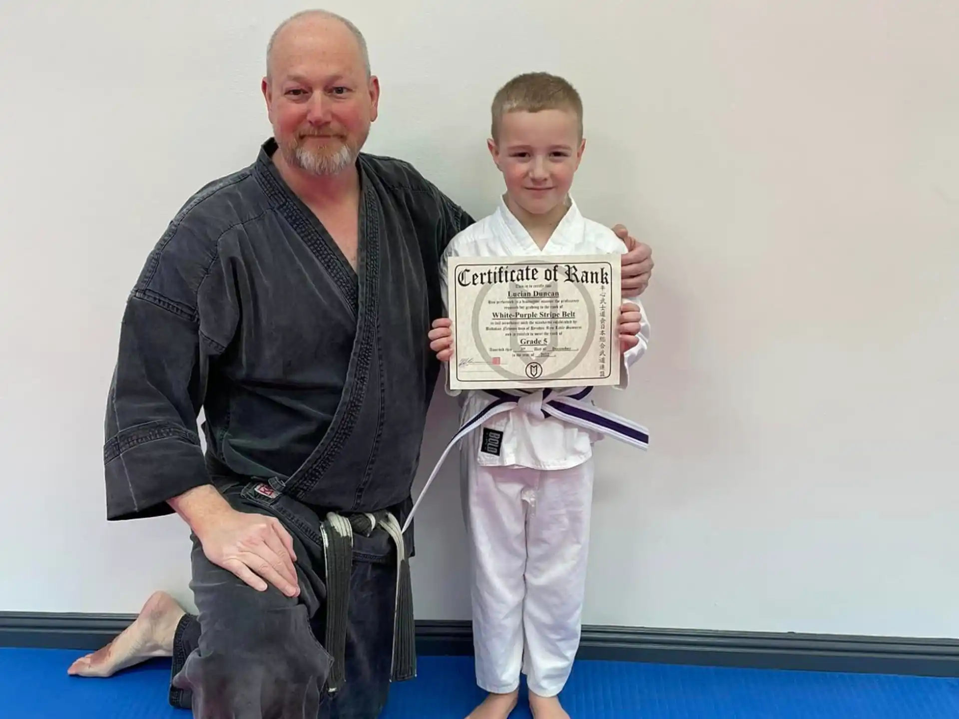 a man and a boy posing for a picture
