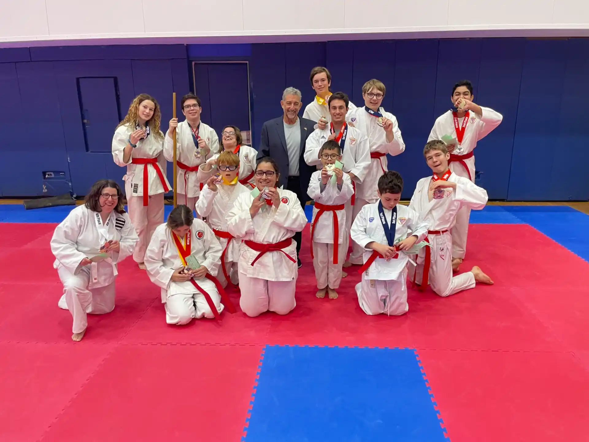 a group of people in karate uniforms
