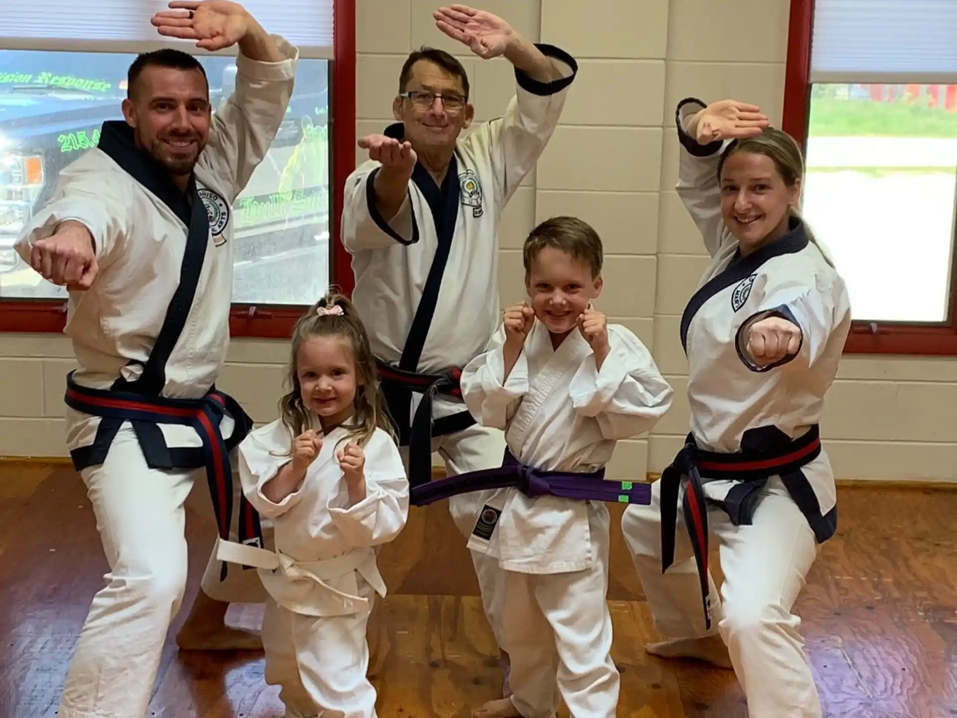 a group of people in karate uniforms