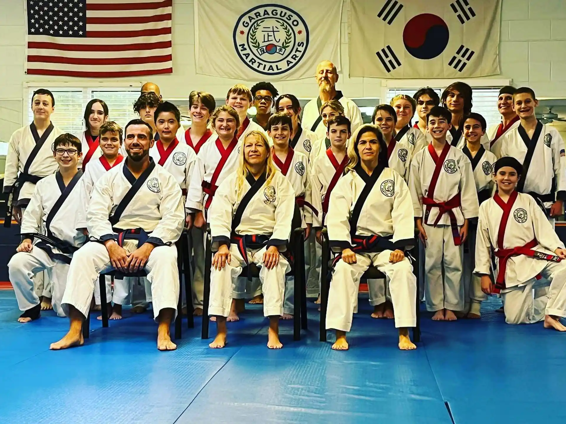 a group of people in karate uniforms