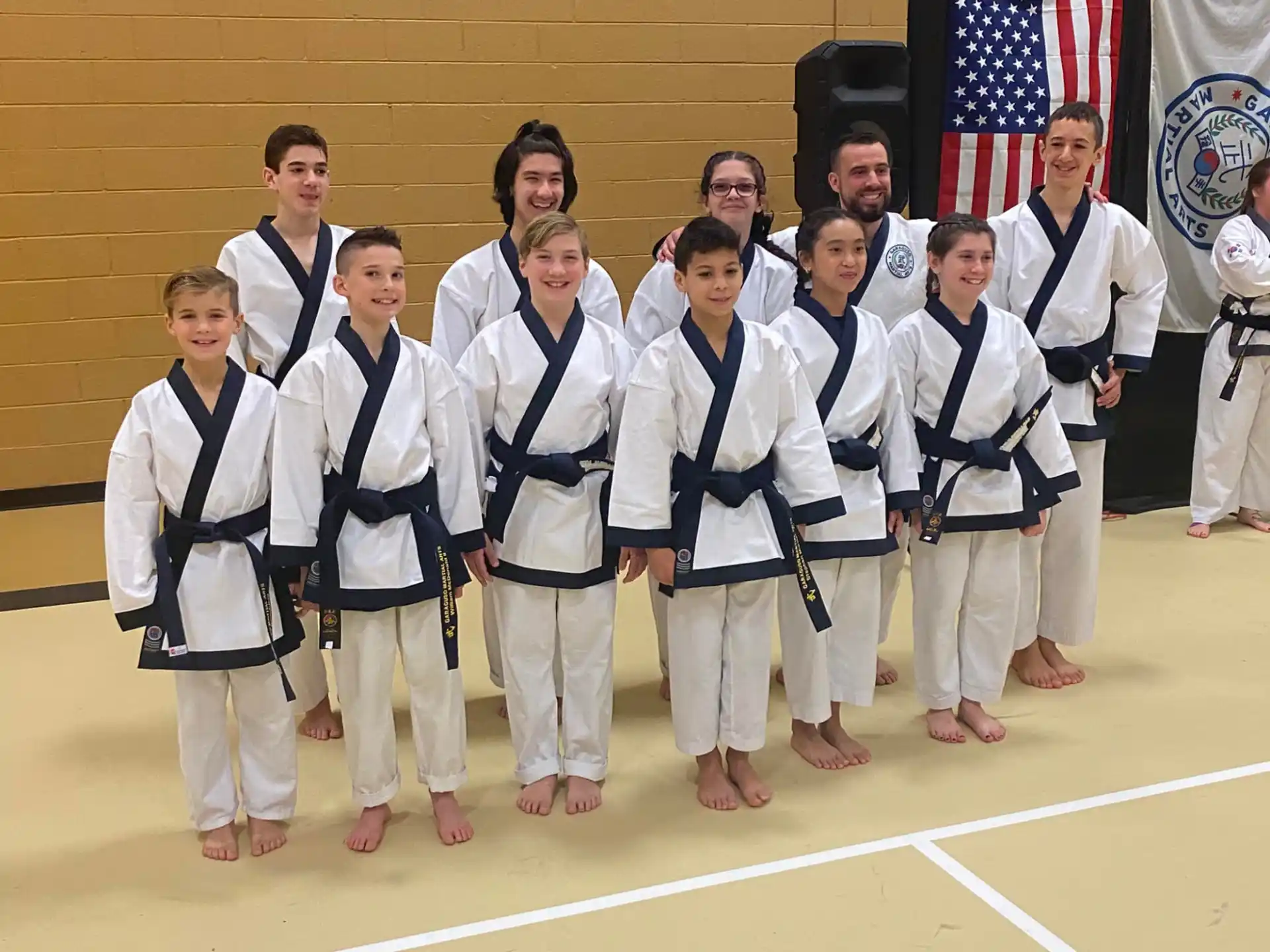 a group of people in karate uniforms