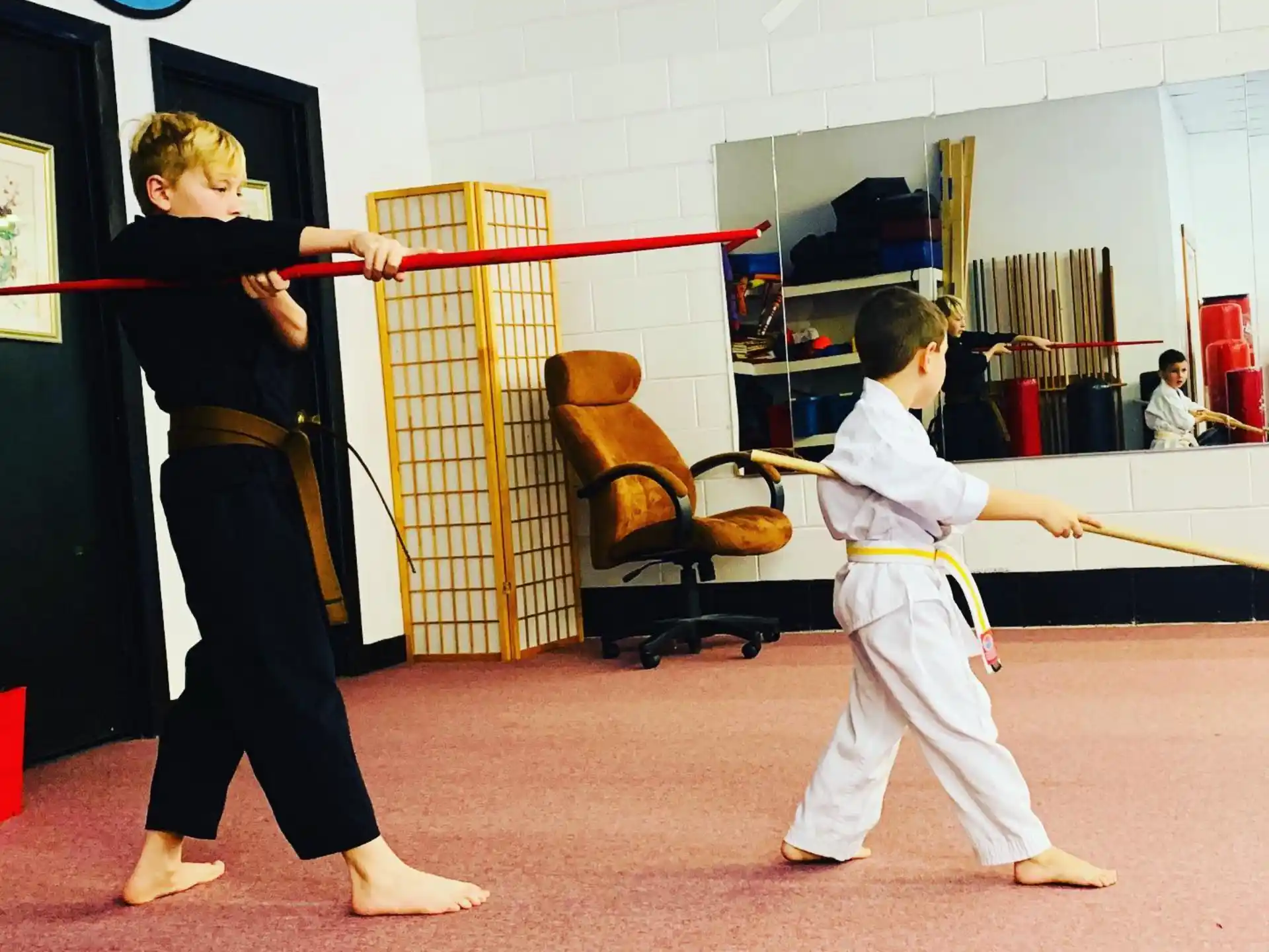 a couple of people in karate uniforms