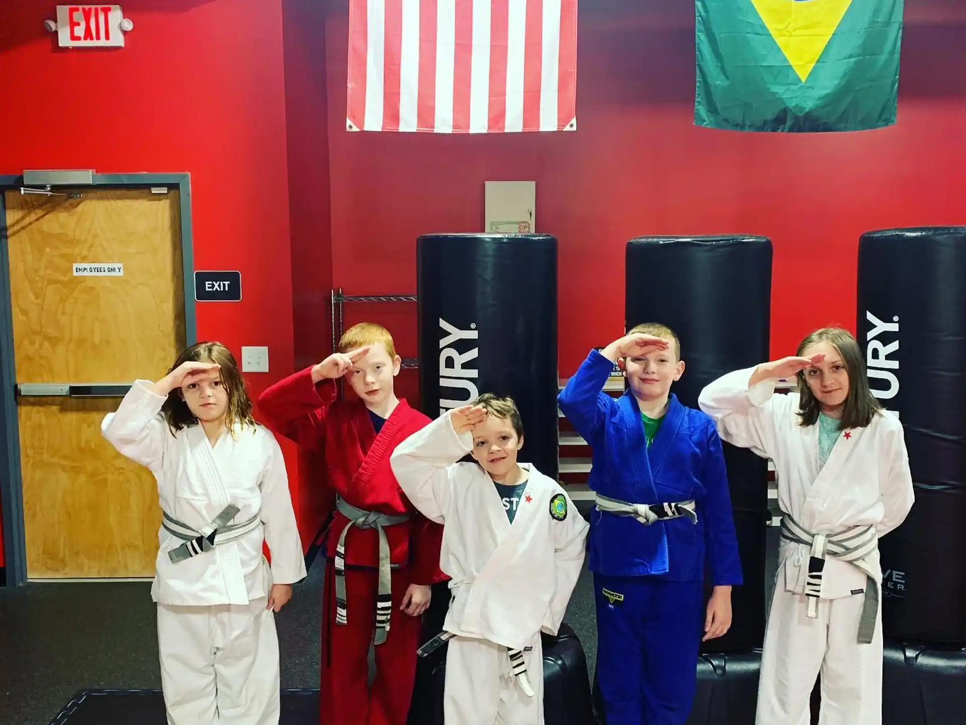 a group of people in karate uniforms