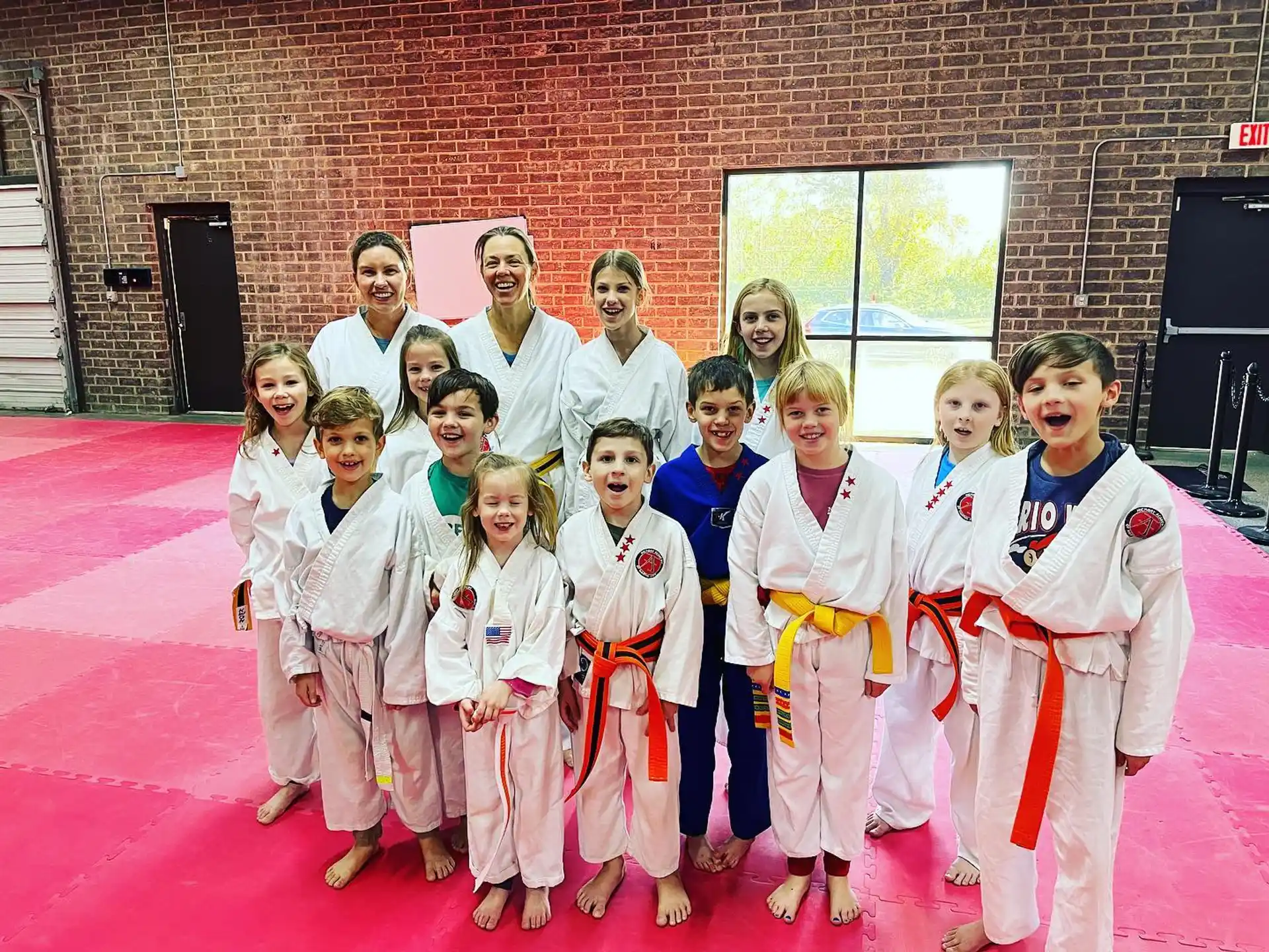a group of people in karate uniforms