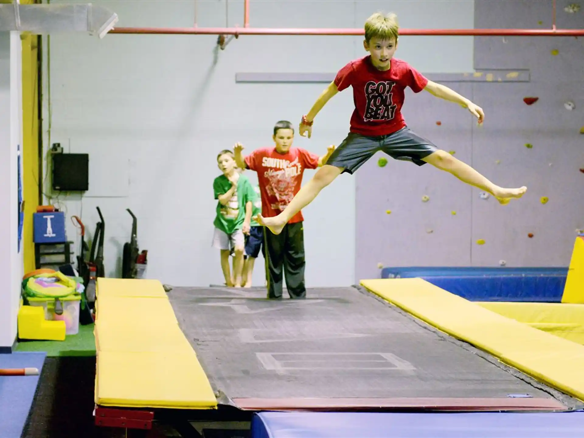 a person jumping over a bar