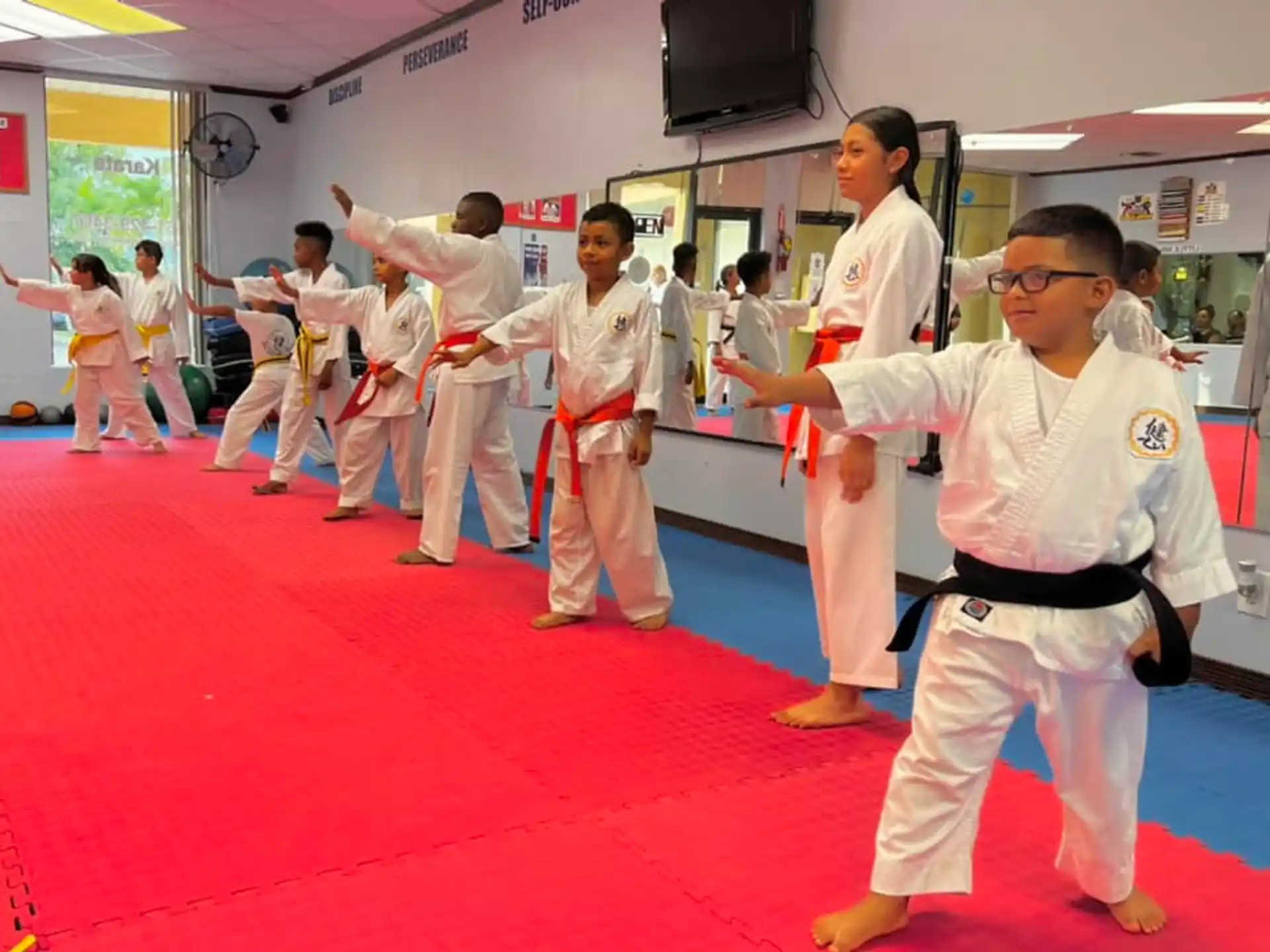 a group of people in karate uniforms