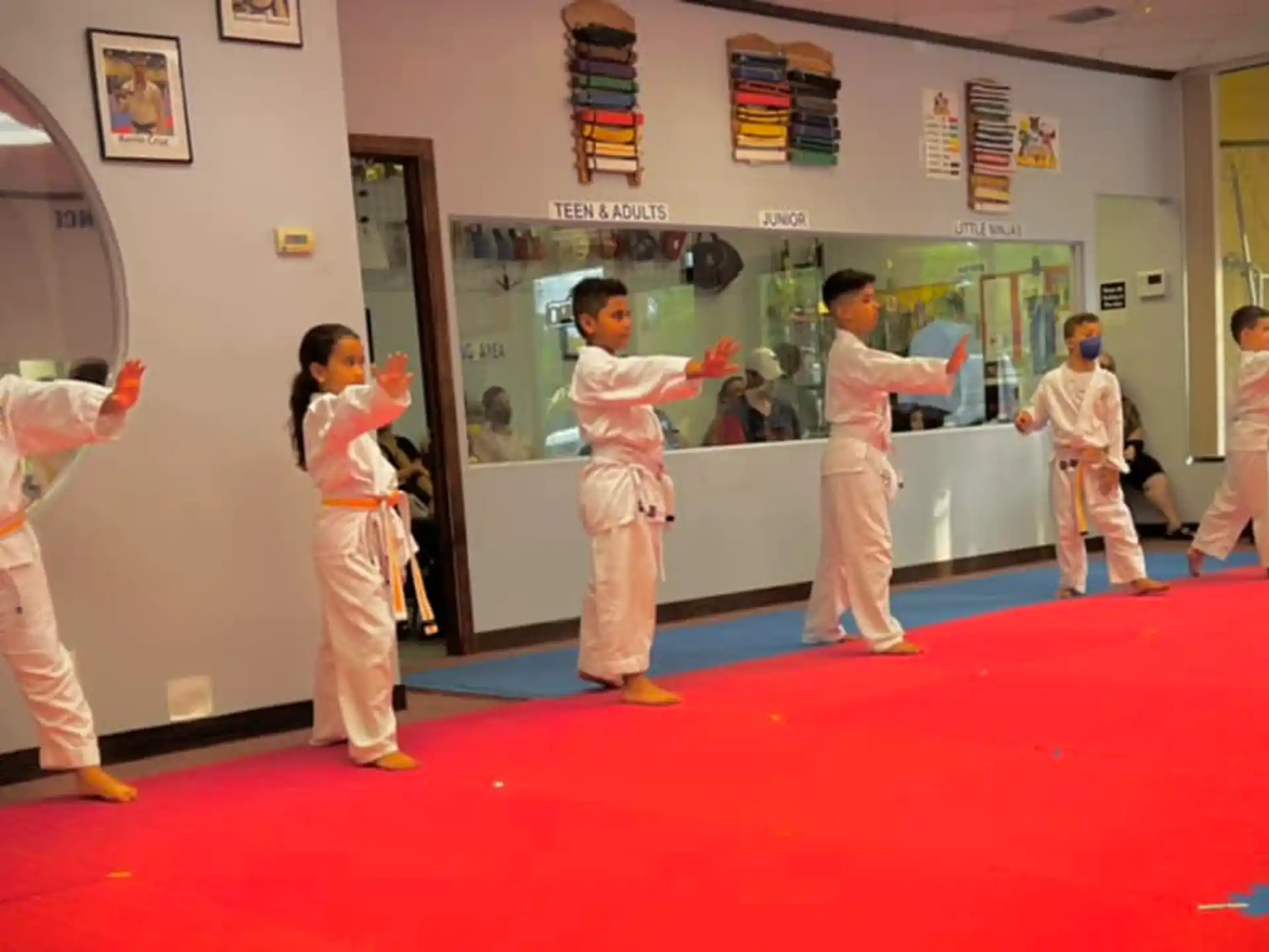 a group of people in karate uniforms