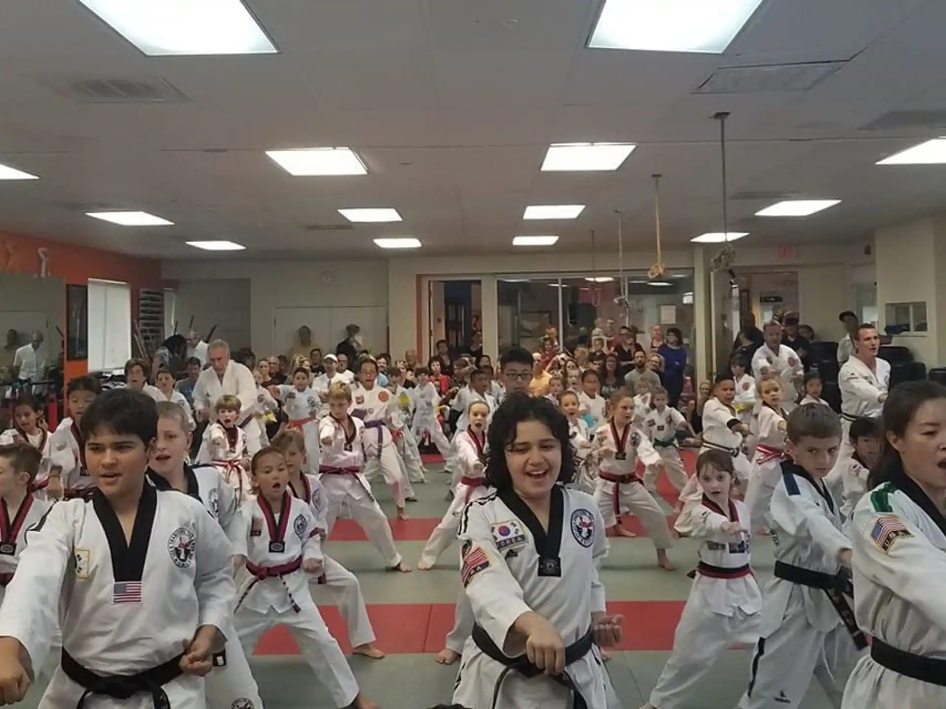a group of people in karate uniforms